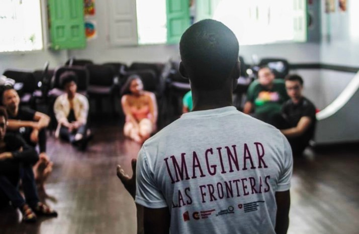 A rear photo of RCHD’s artistic director - Daphné Menard - speaking in front of a group. Credits: ACSS.