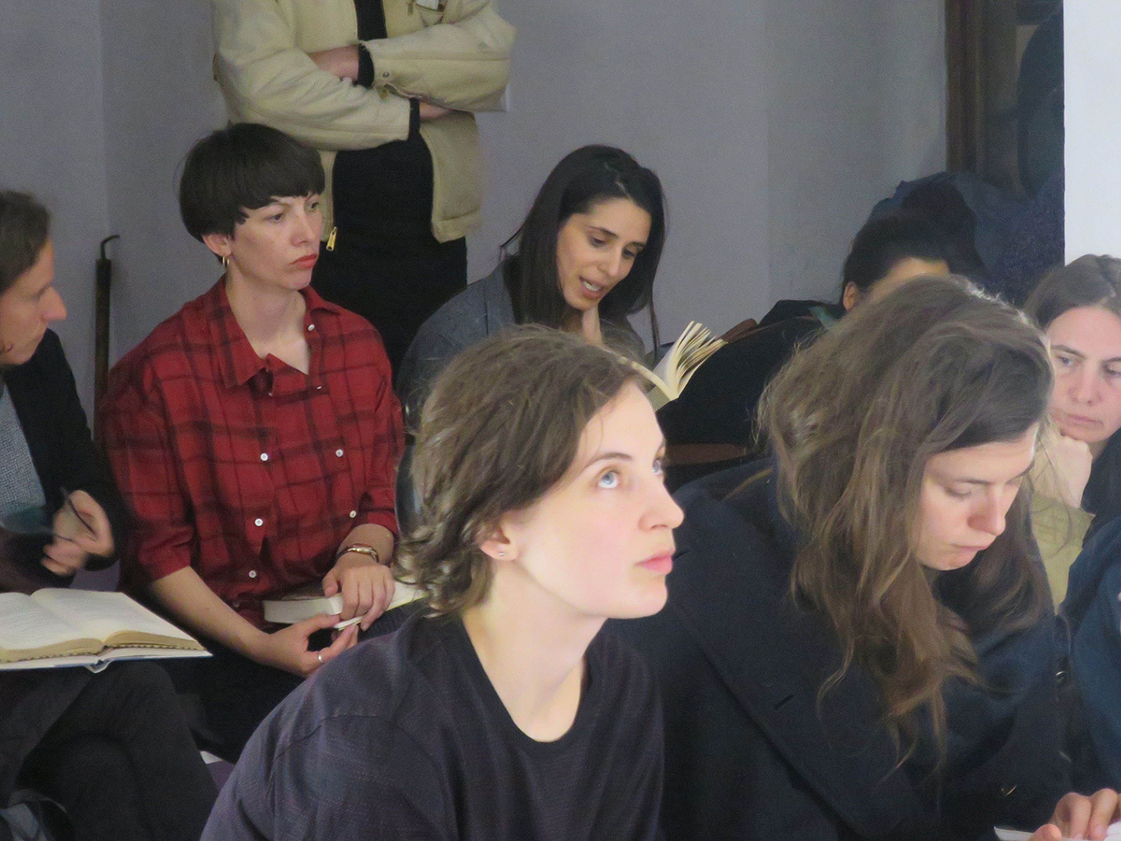 A group of people, mostly women, attending a class or seminar.