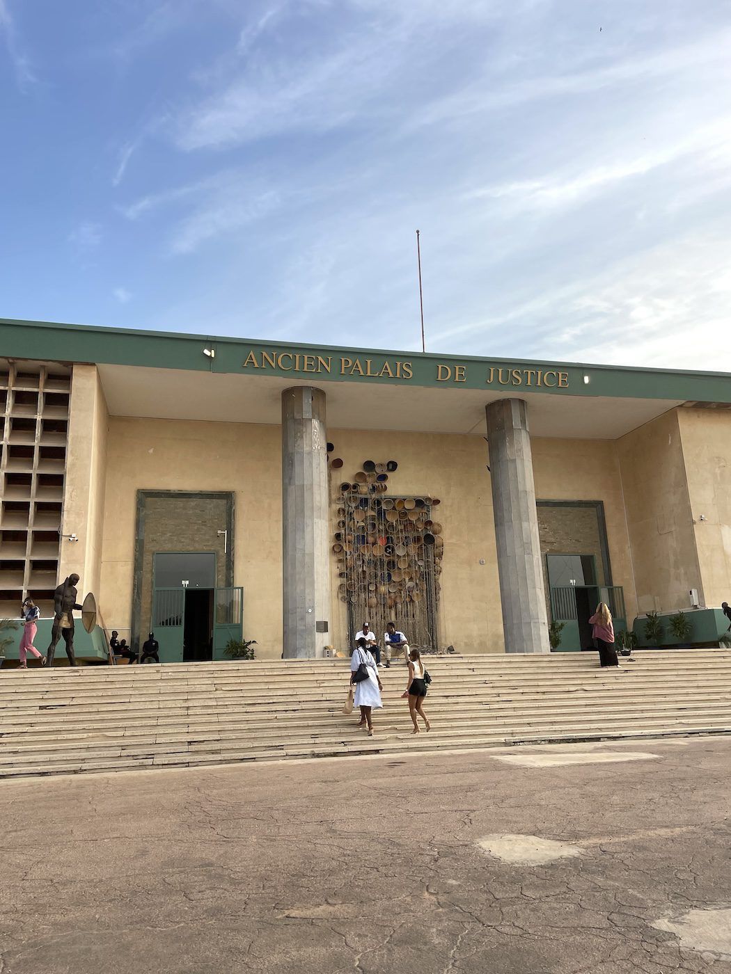 Gina Athena Ulysse, For Those Among Us Who Inherited Sacrifice: Rasanblaj! in front of Ancien Palais de Justice, 15th Dakar Biennale. Photo: Khady | Senegalese Twisted.