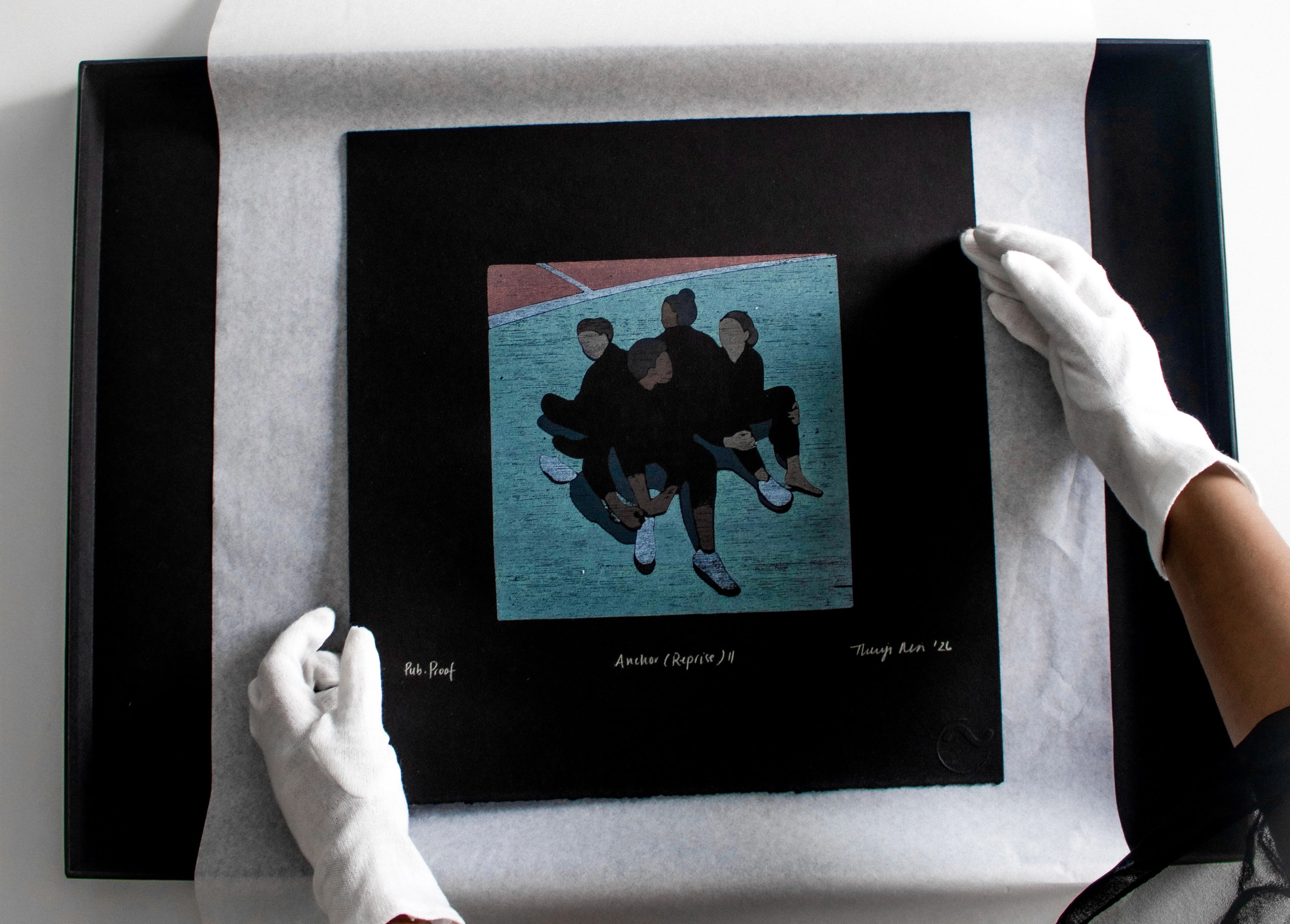 White-gloved hands carefully position a print depicting five figures in a circle within a black frame.