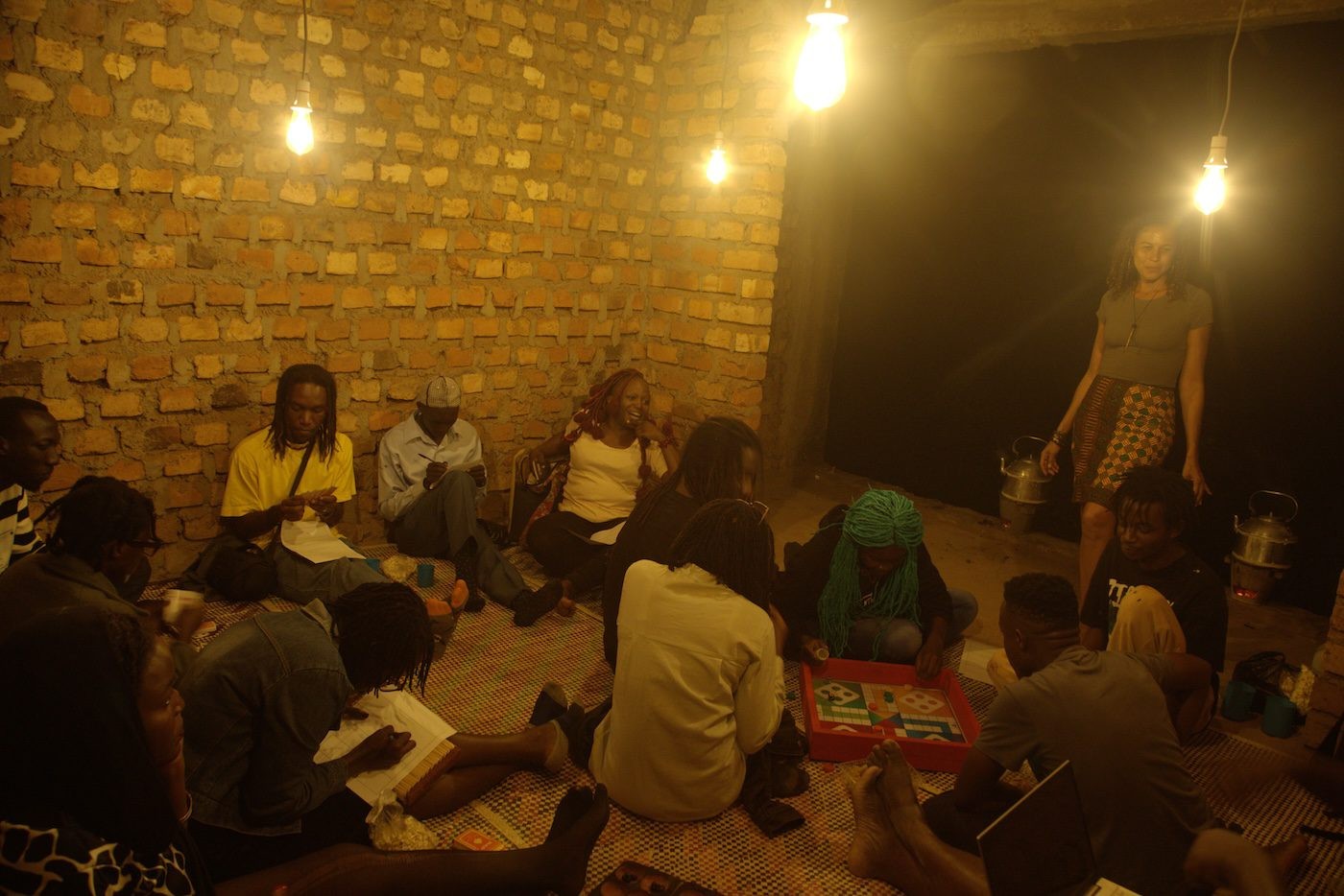 Lisa C Soto, tea ceremony in her installation It reminds me of home (2023) on November 14, 2023 at Silent Invasions: The Art of Material Hacking. Photo: Wasswa James