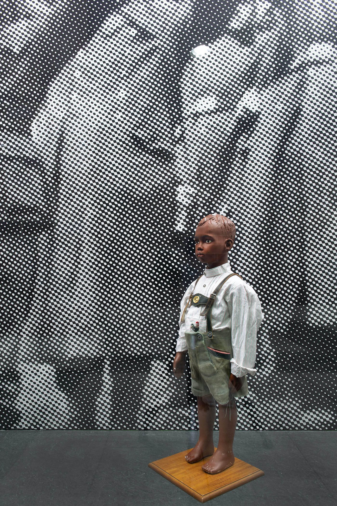 James Gregory Atkinson, Your Job in Germany (Detail), 2021, wall paper, mannequin, lederhosen, installation view, ‘6 Friedberg-Chicago’, Dortmunder Kunstverein. Courtesy: the artist, Dortmunder Kunstverein. Photo: Jens Franke