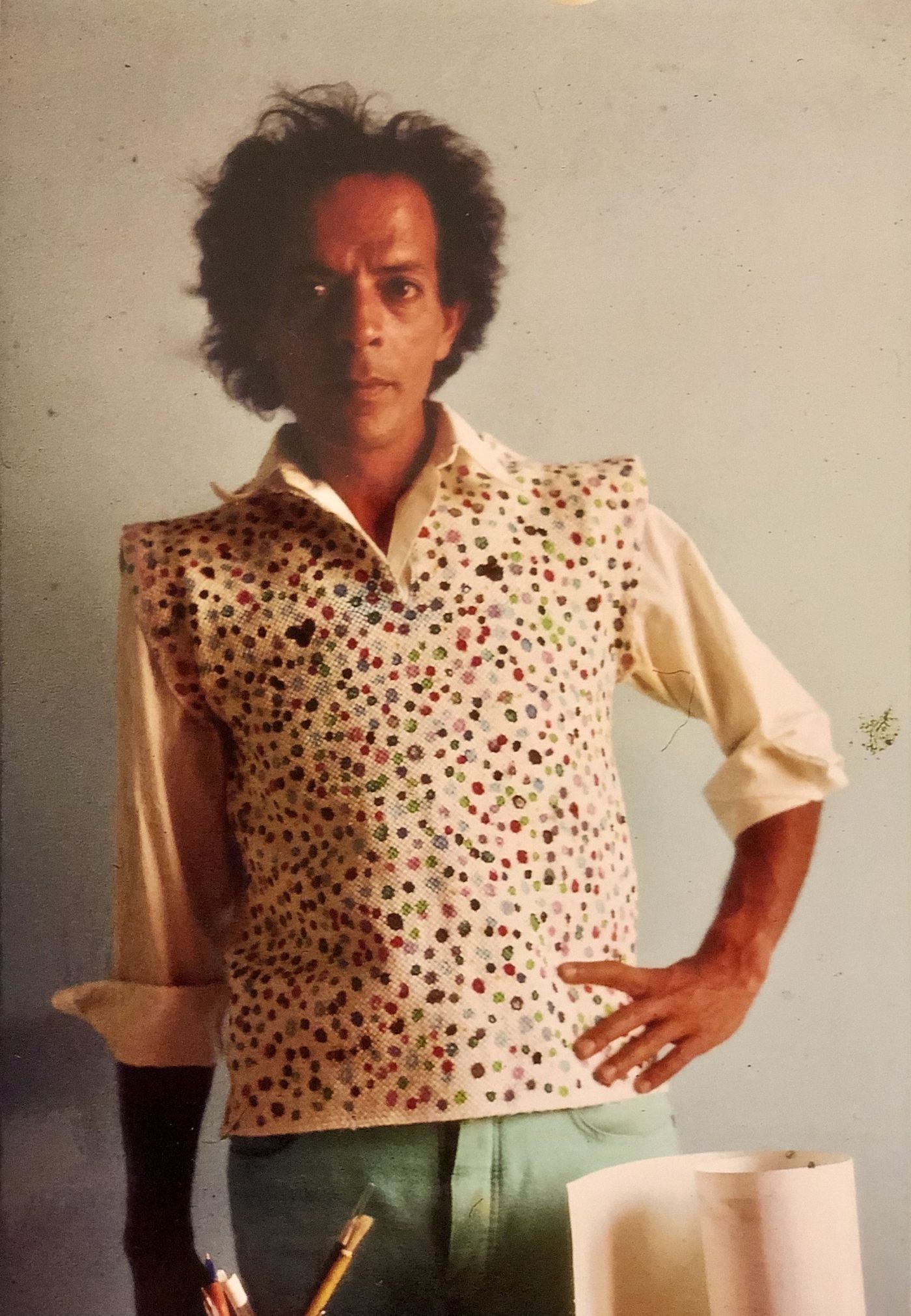 The artist Hamid Zénati in his first self-made shirt, sewed together from cleaning rags that he painted, mid 1970s.
© Hamid Zénati Estate; photographer unknown.