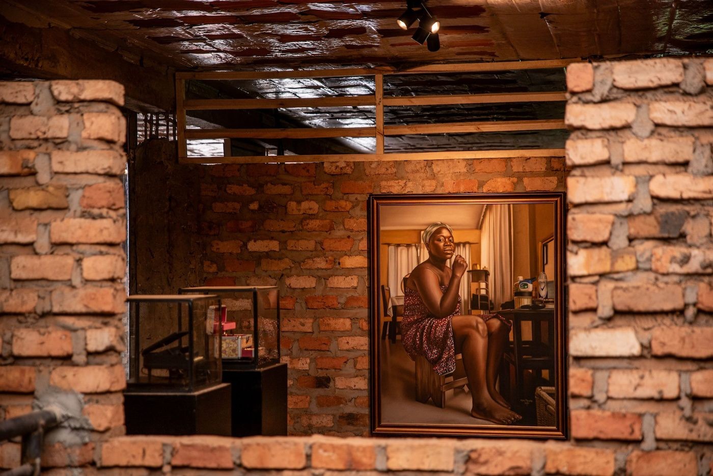 Daniel Arnan Quarshie, Maame Adakaba, 2023, jewelry box, plinth and glass box; Rewinder, 2023, music box, plinth and glass box and Afia Prempeh, Girl with the chewing stick, 2022, Oil on canvas, 139 x 109 cm at Silent Invasions: The Art of Material Hacking. Photo: Atiko Anthony