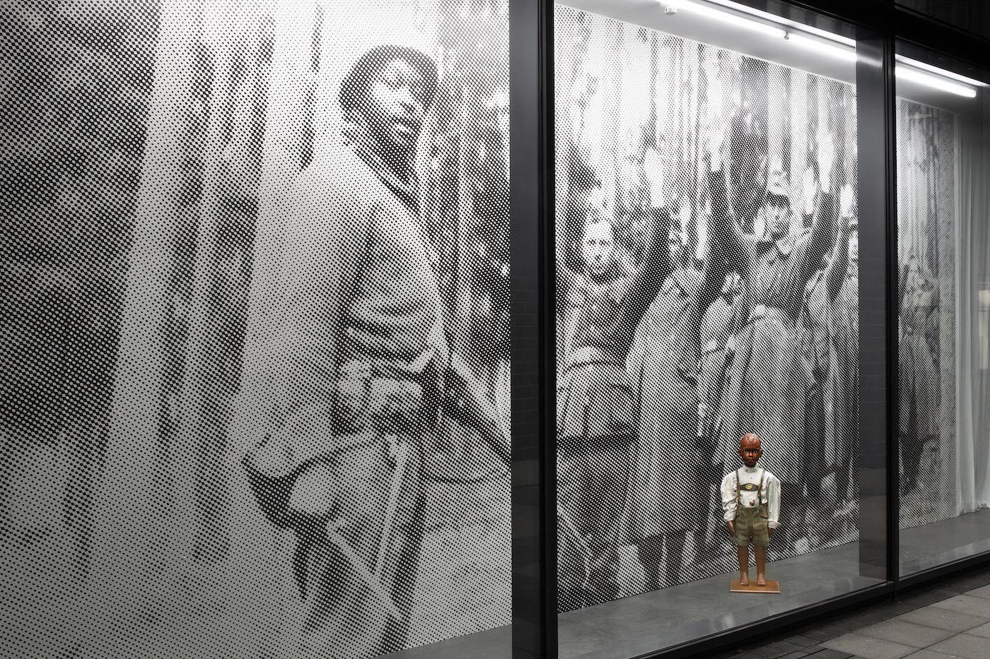 James Gregory Atkinson, Your Job in Germany, 2021, wall paper, mannequin, lederhosen, installation view, ‘6 Friedberg-Chicago’, Dortmunder Kunstverein . Courtesy: the artist, Dortmunder Kunstverein. Photo: Jens Franke