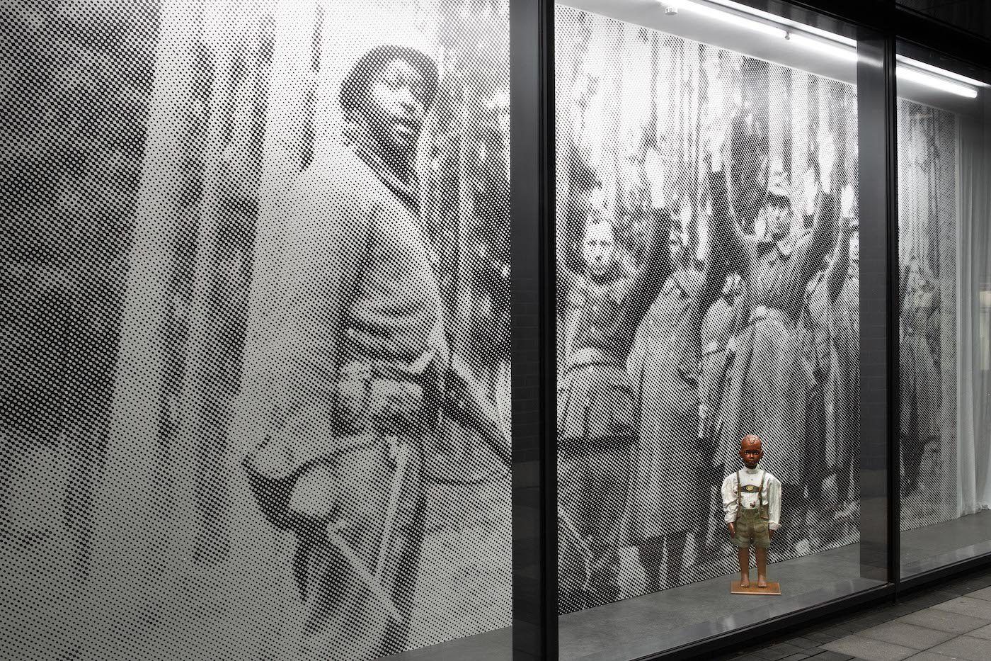 James Gregory Atkinson, Your Job in Germany, 2021, wall paper, mannequin, lederhosen, installation view, ‘6 Friedberg-Chicago’, Dortmunder Kunstverein . Courtesy: the artist, Dortmunder Kunstverein. Photo: Jens Franke