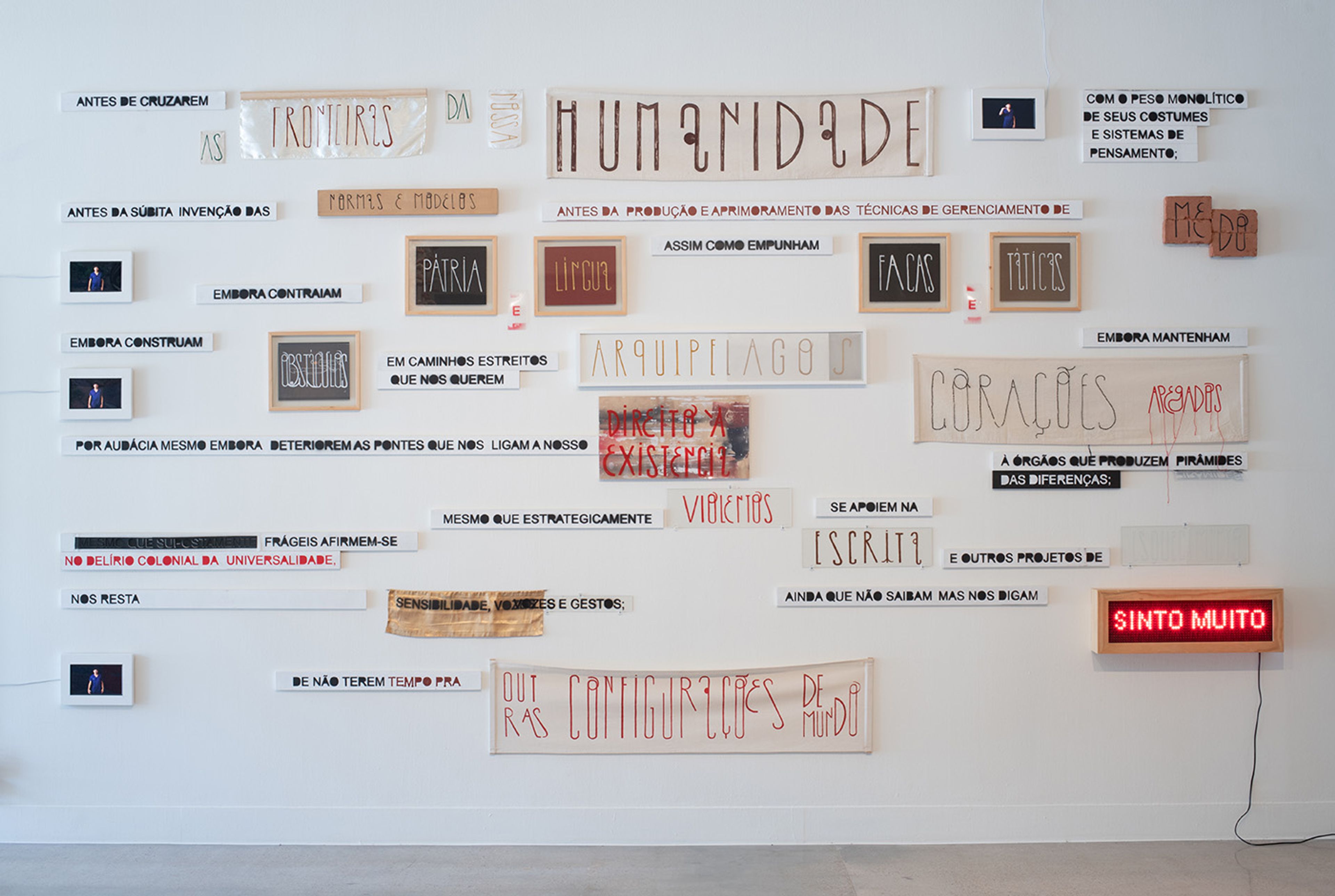 Maré de Matos, Fundamento [Foundation], 2019. Paint on canvas, fabric, clay, wood, acrylic panel, LED sign, video, color, sound. 118 1/8 x 196 7/8 in. (300 x 500 cm). Courtesy of the artist. Social Fabric: Art and Activism in Contemporary Brazil, installation view, Visual Arts Center, The University of Texas at Austin, September 23, 2022 – March 10, 2023. Photo: Sandy Carson