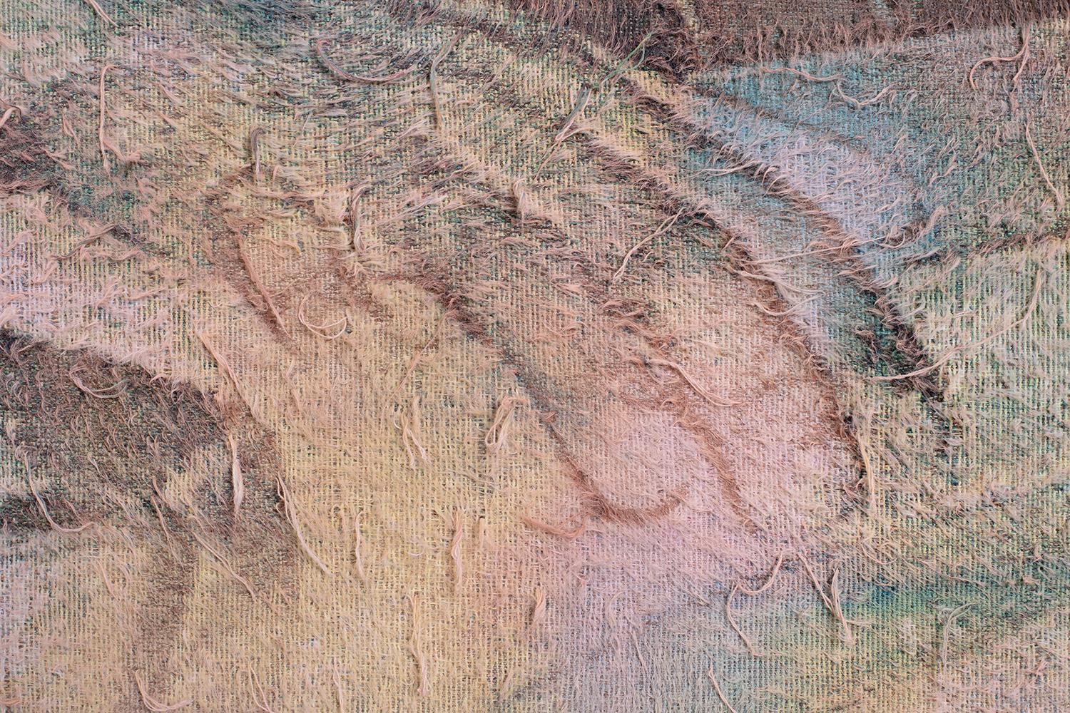 Textured fabric with raised threads and faded abstract patterns in pink, blue, and beige.