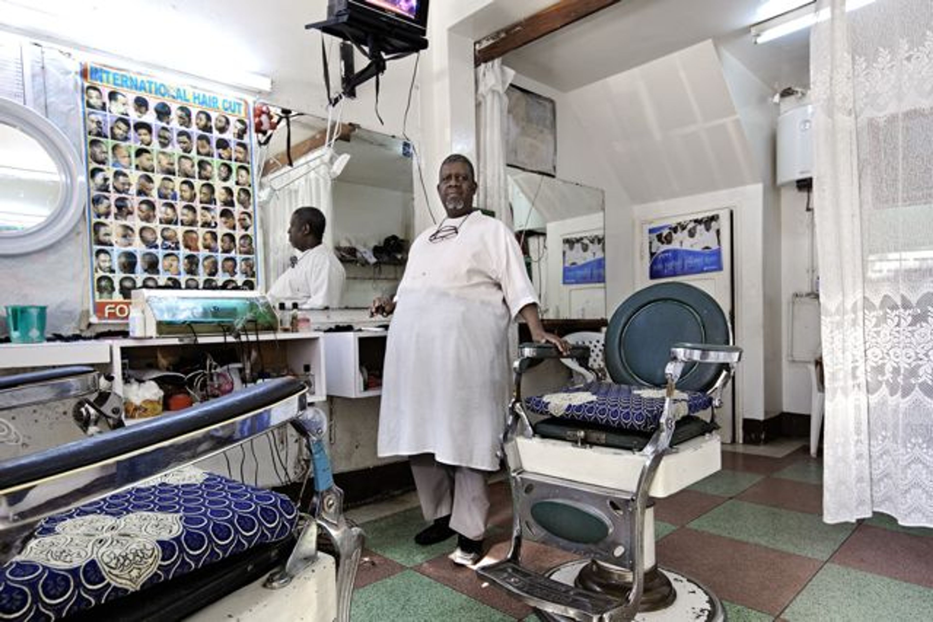 Filipe Branquinho ‚António Muianga, Barbeiro-Barber’ from the series ‚Occupations'. © Filipe Branquinho 