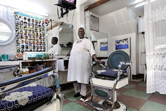 Filipe Branquinho ‚António Muianga, Barbeiro-Barber’ from the series ‚Occupations'. © Filipe Branquinho