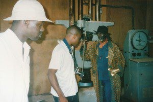 El Sy, Chika Okeke and Issa Samb visiting the brick-pressing plant. The Chinese laborers produced the bricks for the sports stadium, 1996. Photo Clémentine Deliss