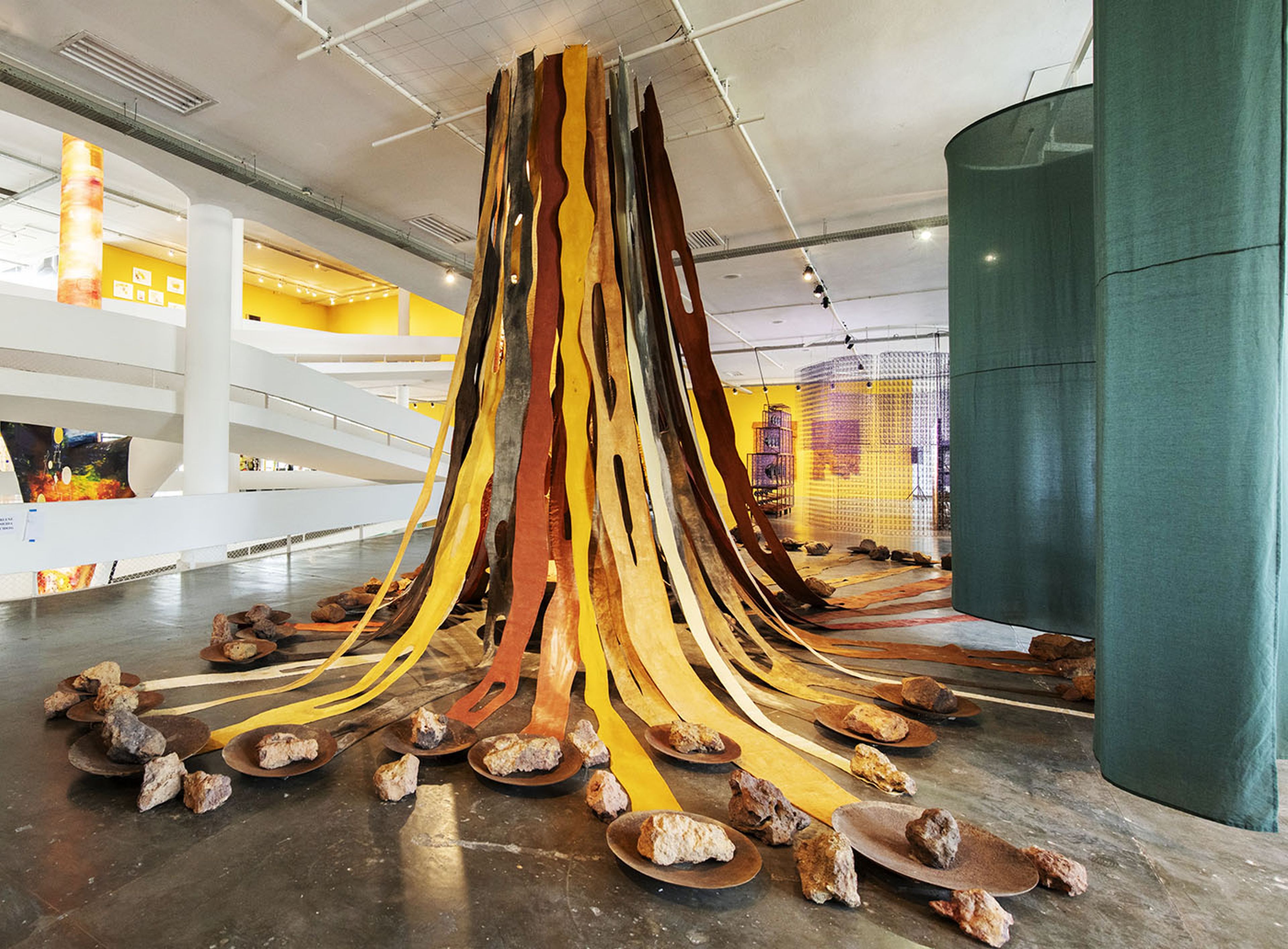 Marlene Almeida, Living Soil, 2025. Installation composed of strips of raw cotton fabric and matte tempera. Museum of Brazilian Soils, 1970-2025. Courtesy: Almeida &amp; Dale. Commissioned by Fundação Bienal de São Paulo for the 36th Bienal. Photo: Cristian Baena