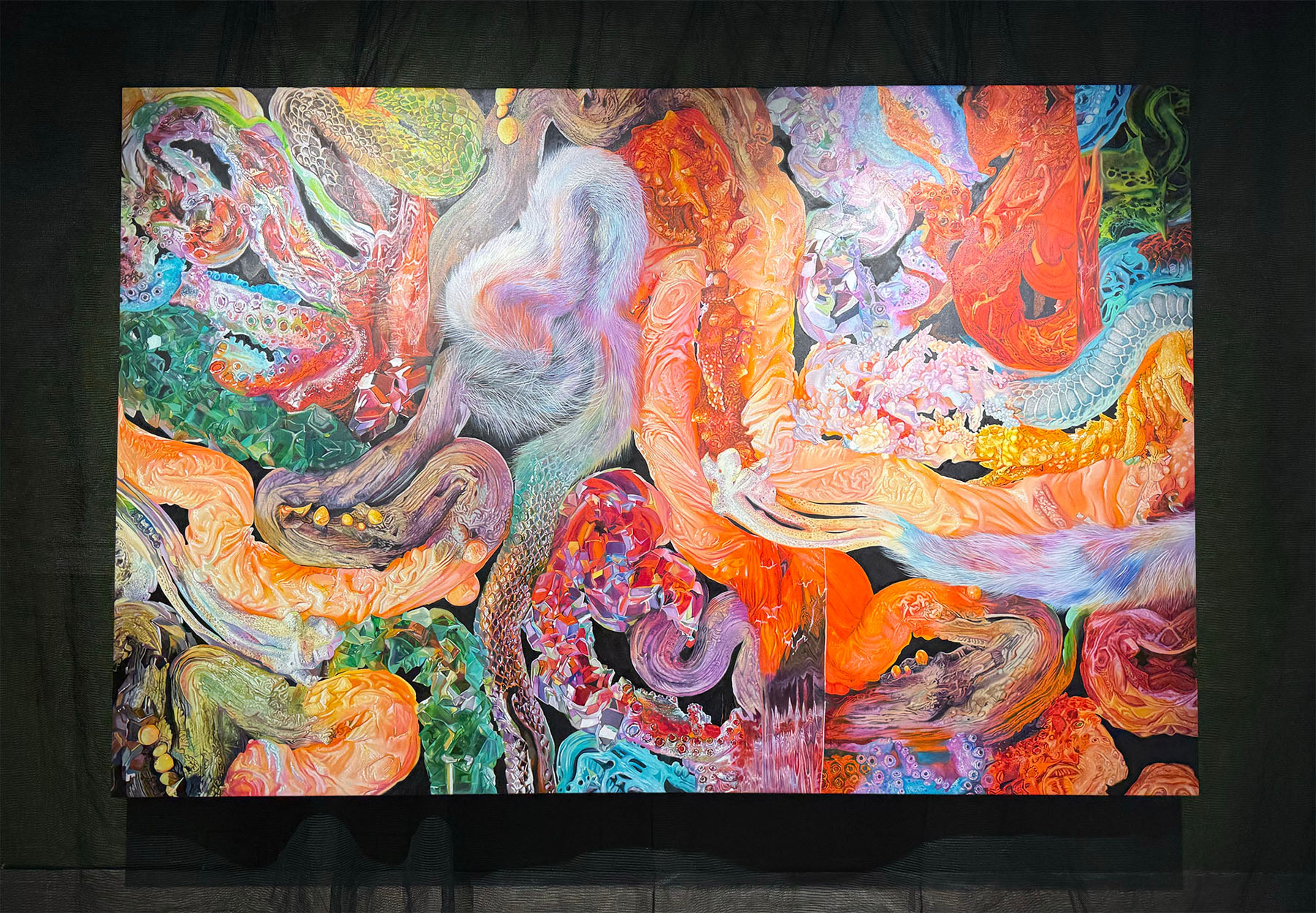Vibrant abstract painting of swirling organic forms on black.