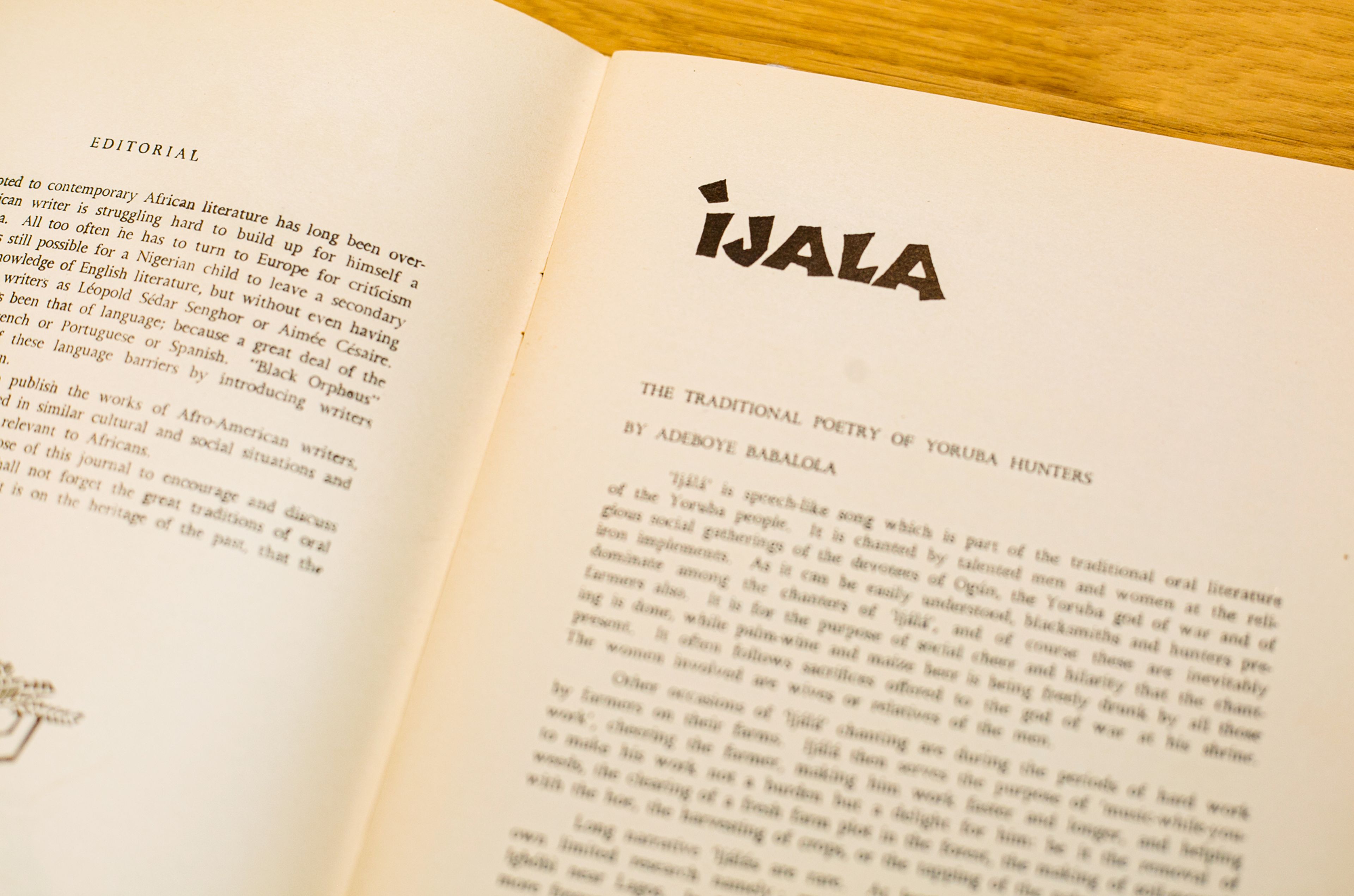 Open book with pages showing an "EDITORIAL" on the left and an article titled "iJALA: The Traditional Poetry of Yoruba Hunters" on the right.