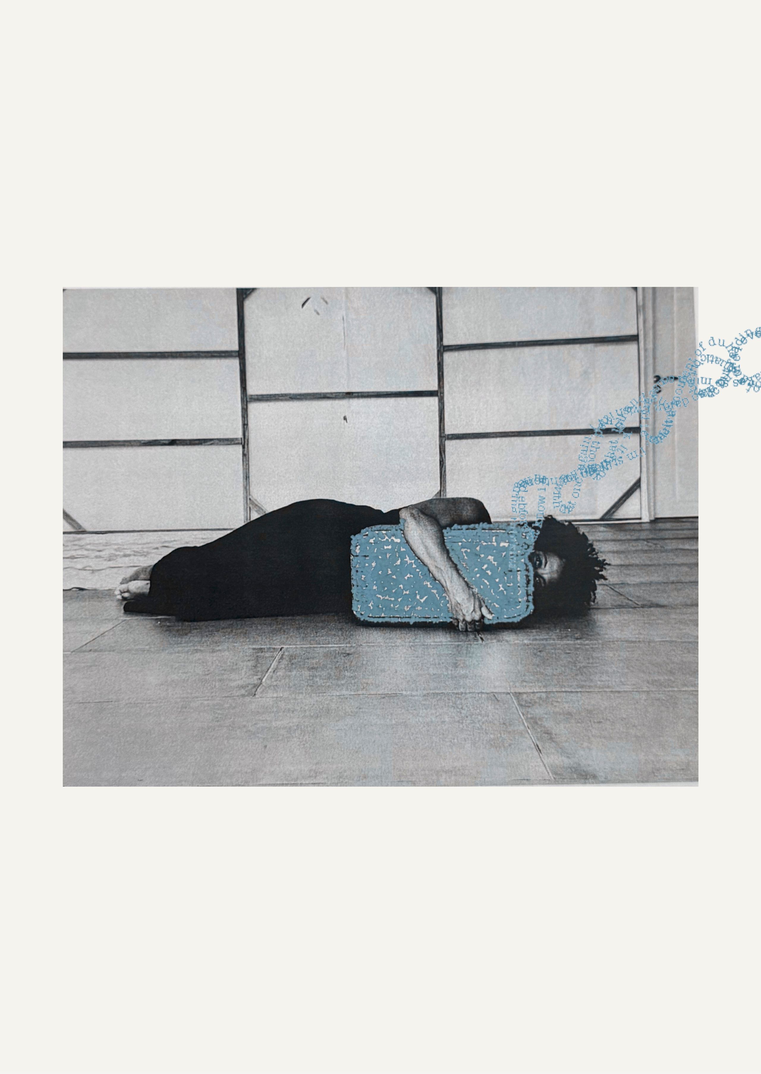 Black and white image of a woman lying on her side, head resting on a textured blue block, with a blue DNA-like swirl of text above her.