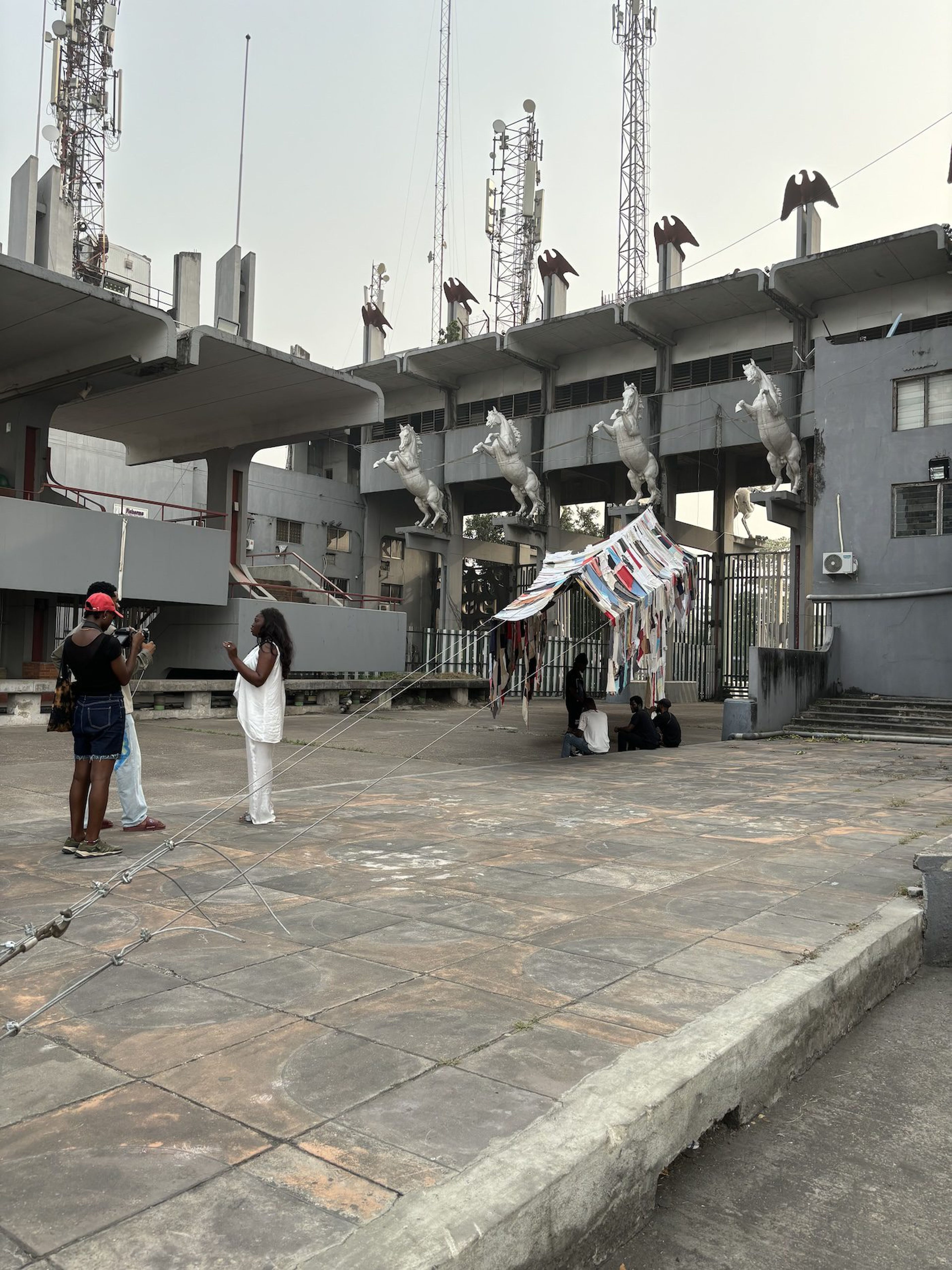 Outsiders: Martinka Bobrikova, Oscar de Carmen, Mari’a Alejendra Gatti, Anto Lloveras , Re(t)ex Hile, 2024. Installation view of Lagos Biennale 2024 at Tafawa Balewa Square. Photo: Sinazo Chiya