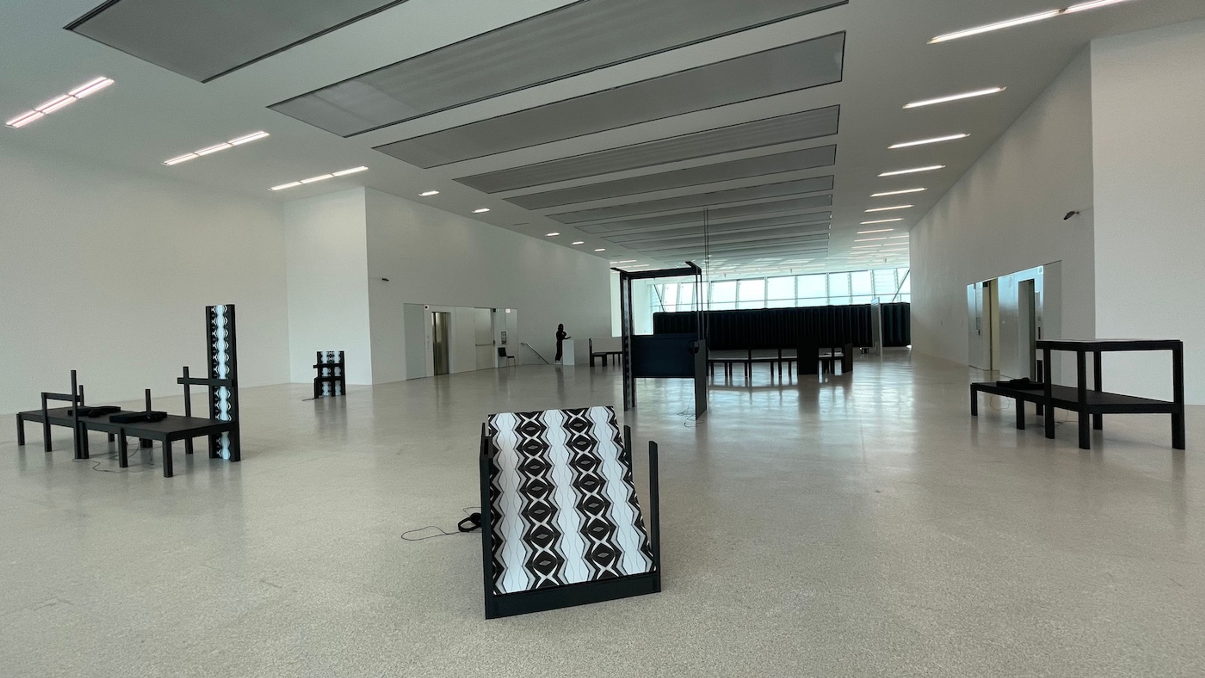 Museion, Techno, 2021. Exhibition View. (In the front: Emeka Ogboh, Beyond the Yellow Haze, 2021). Photo: Jamila Moroder