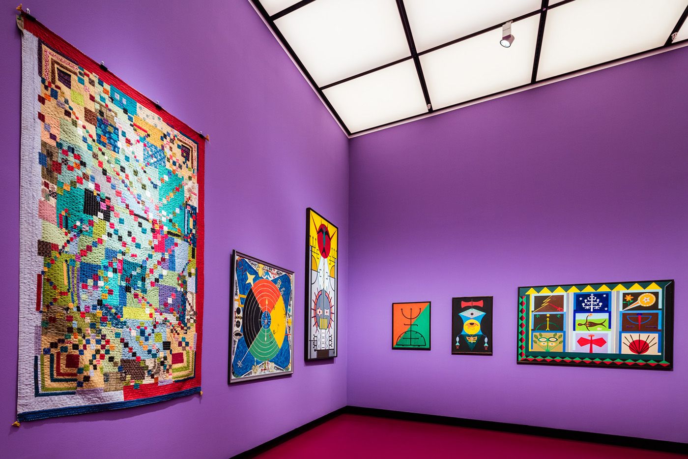 Hattarabi Maulasab Gunjavati, Untitled (2023); Everald Brown, Mystical Signs (1994), courtesy of the National Gallery of Jamaica; Abdias Nascimento, Ponto Riscado da Liberdade (Sacred Sign for Freedom, 1974), Quilombismo (Exu e Ogun, 1980), Afro Estandarte (African Standard, 1993), Teogonia Afro-Brasileira n. 2: Iansã, Obatalá, Oxum, Oxóssi, Yemanjá, Ogun, Ossaim, Xangô, Exu (Afro-Brazilian Theogony n. 2: Iansan, Obatala Oshun, Oshossi, Yemanja, Ogun, Osanyin, Shango, Eshu, 1972), courtesy of the Instituto de Pesquisas and Afro-Brazilian Studies IPEAFRO. Installation view of O Quilombismo: Of Resisting and Insisting. Of Flight as Fight. Of Other Democratic Egalitarian Political Philosophies, Haus der Kulturen der Welt (HKW), 2023. Photo: Laura Fiorio/HKW