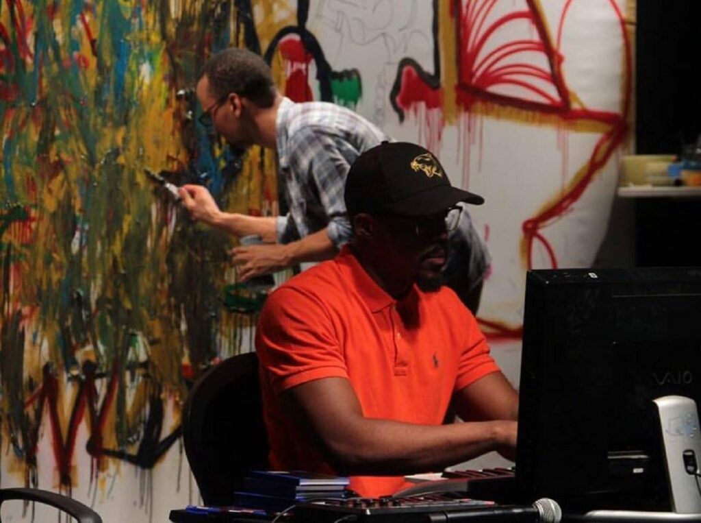Producer Ikon and Artist Olatunde Alara during the "Intersections" performance installation- a one of a kind live art and sound performance. Taking art from its usual canvas into a more interactive audio visual installation.