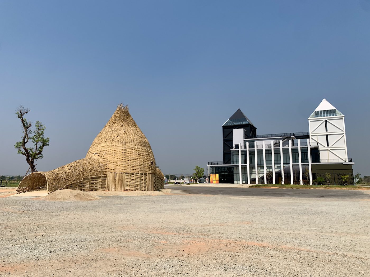 (left) Wang Wen-Chih, Beyond the Site, 2023. This particular artwork for the Thailand Biennale is a collaboration between artisans from Taiwan and craftsmen in Chaing Rai. It offers a spiritual exploration of self and soul, presenting a unique woldview that invites the audience to delve into the depths of their minds; (right) Chiang Rai International Art Museum (CIAM). Photo: C&amp;