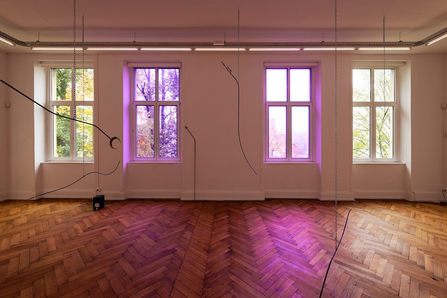 Tarek Lakhrissi, Unfinished Sentence, 2019. 10 metal spears, chains, colour filter, loud speakers. CRAC Alsace, Altkirch, FR. Photographer: Aurélien Mole. Courtesy of the artist and VITRINE London/Basel.