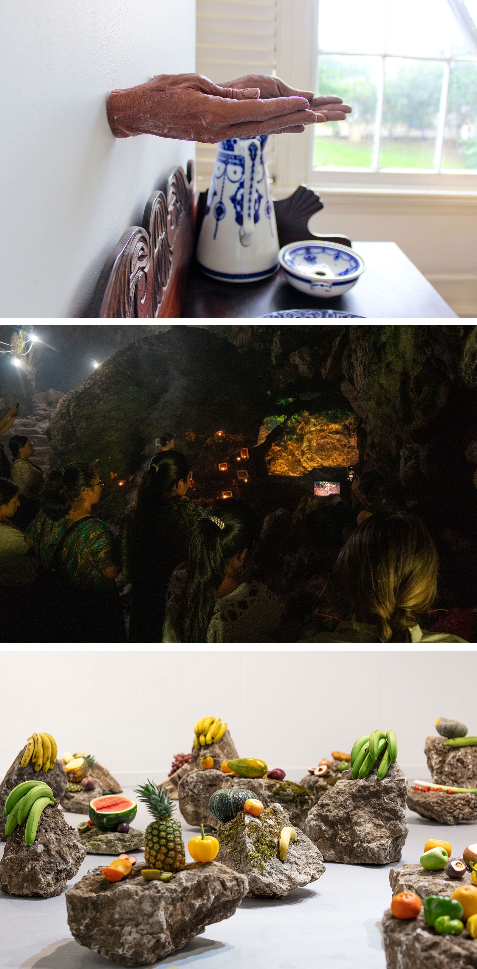 A collage of three art scenes: hands emerging from a wall, people in a glowing cave, and fruits on rocks.