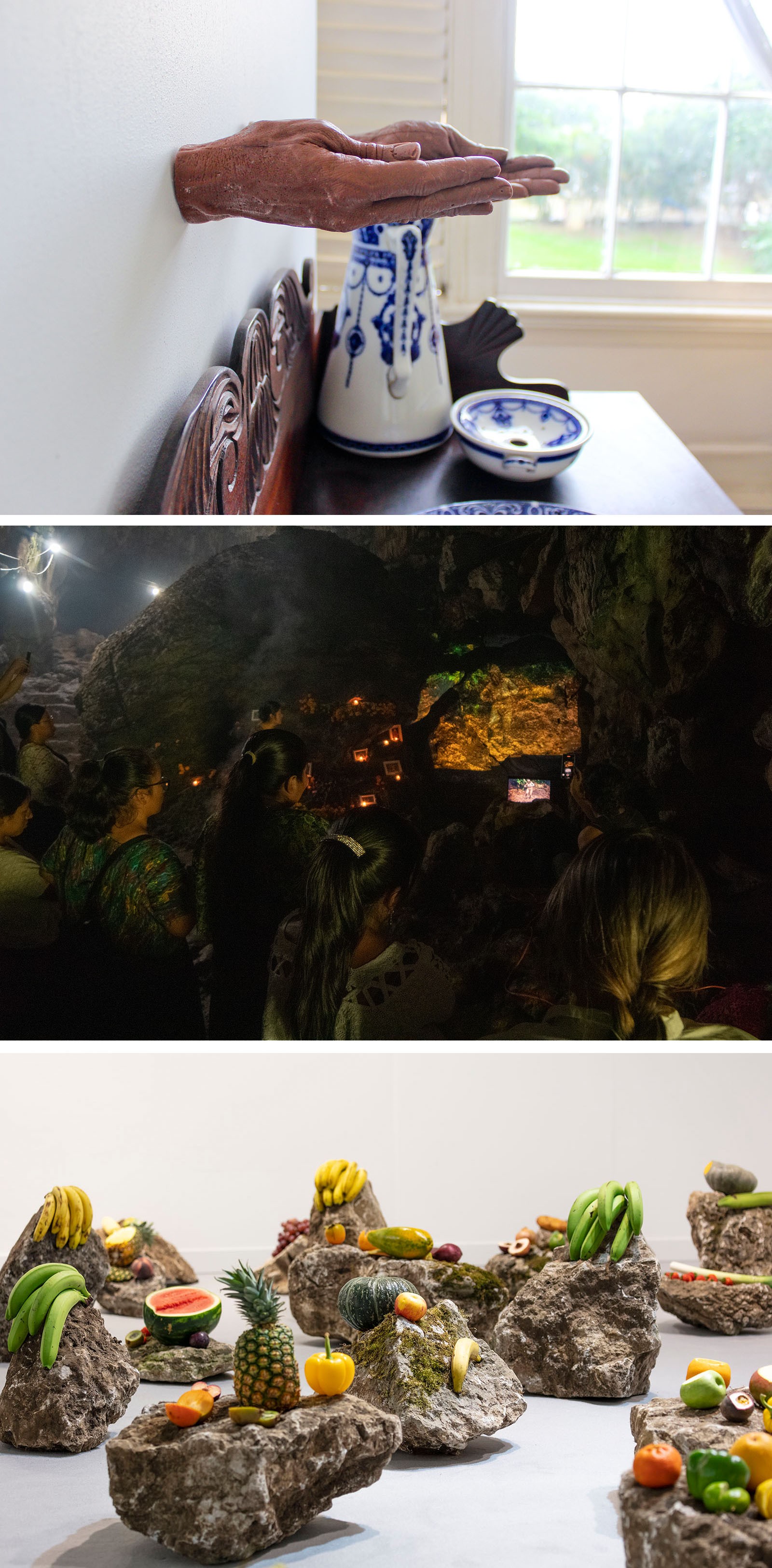 A collage of three art scenes: hands emerging from a wall, people in a glowing cave, and fruits on rocks.