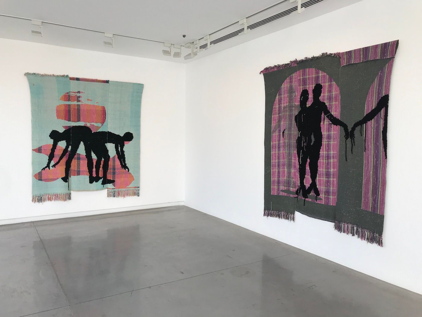 (left) Diedrick Brackens, Stealing dark from the sky, 2022. (right) Diedrick Brackens, The night is my shepherd, 2022. Installation view at Sharjah Biennial 15. Photo: C&amp;.