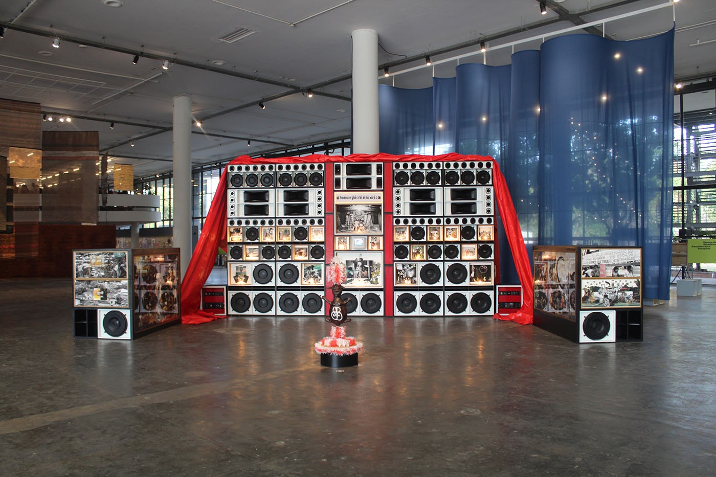 Gê Viana, Dan's Harvest, 2025. Installation composed of sound wall, photographs, hand collages, and canvases. Courtesy Galeria Lima. Commissioned by Fundação Bienal de São Paulo for the 36th Bienal. Photo: Cristian Baena