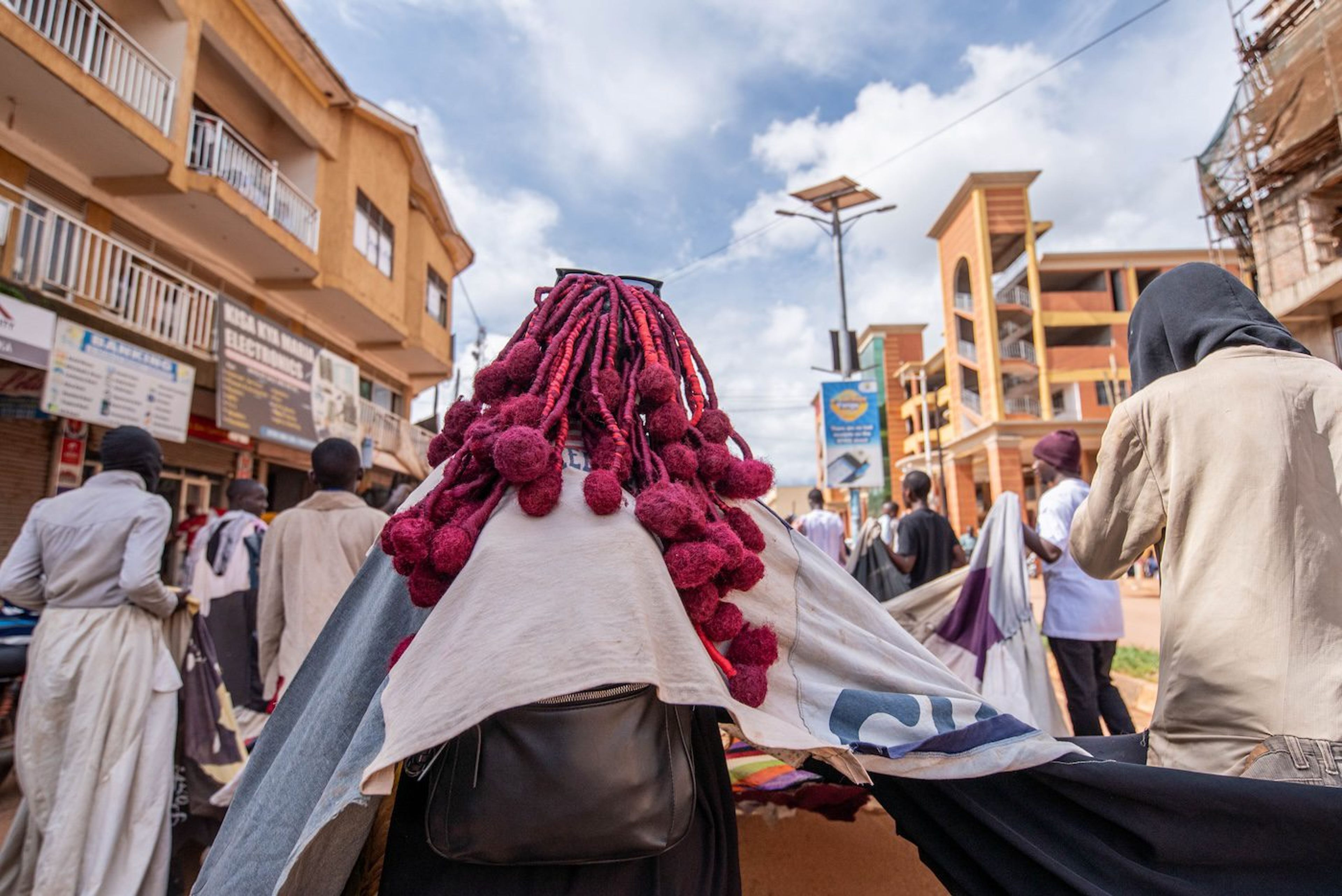 Sandra Suubi, Olugoye lwaffe, 2023, public procession from Masaka Central Market to Amasaka Gallery, November 11, 2023. Photo: Atiko Anthony
