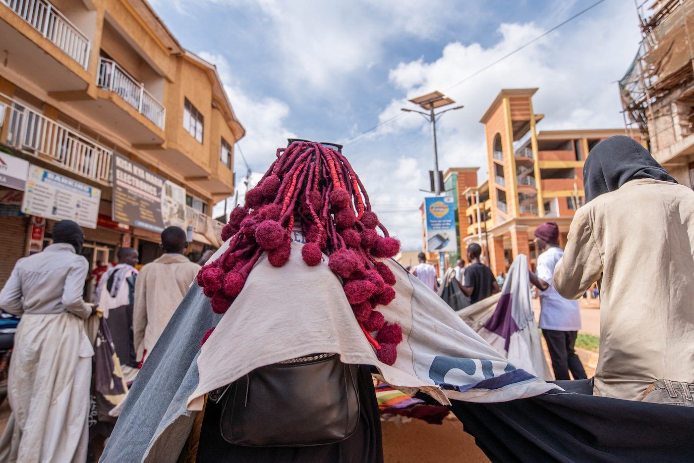 Sandra Suubi, Olugoye lwaffe, 2023, public procession from Masaka Central Market to Amasaka Gallery, November 11, 2023. Photo: Atiko Anthony