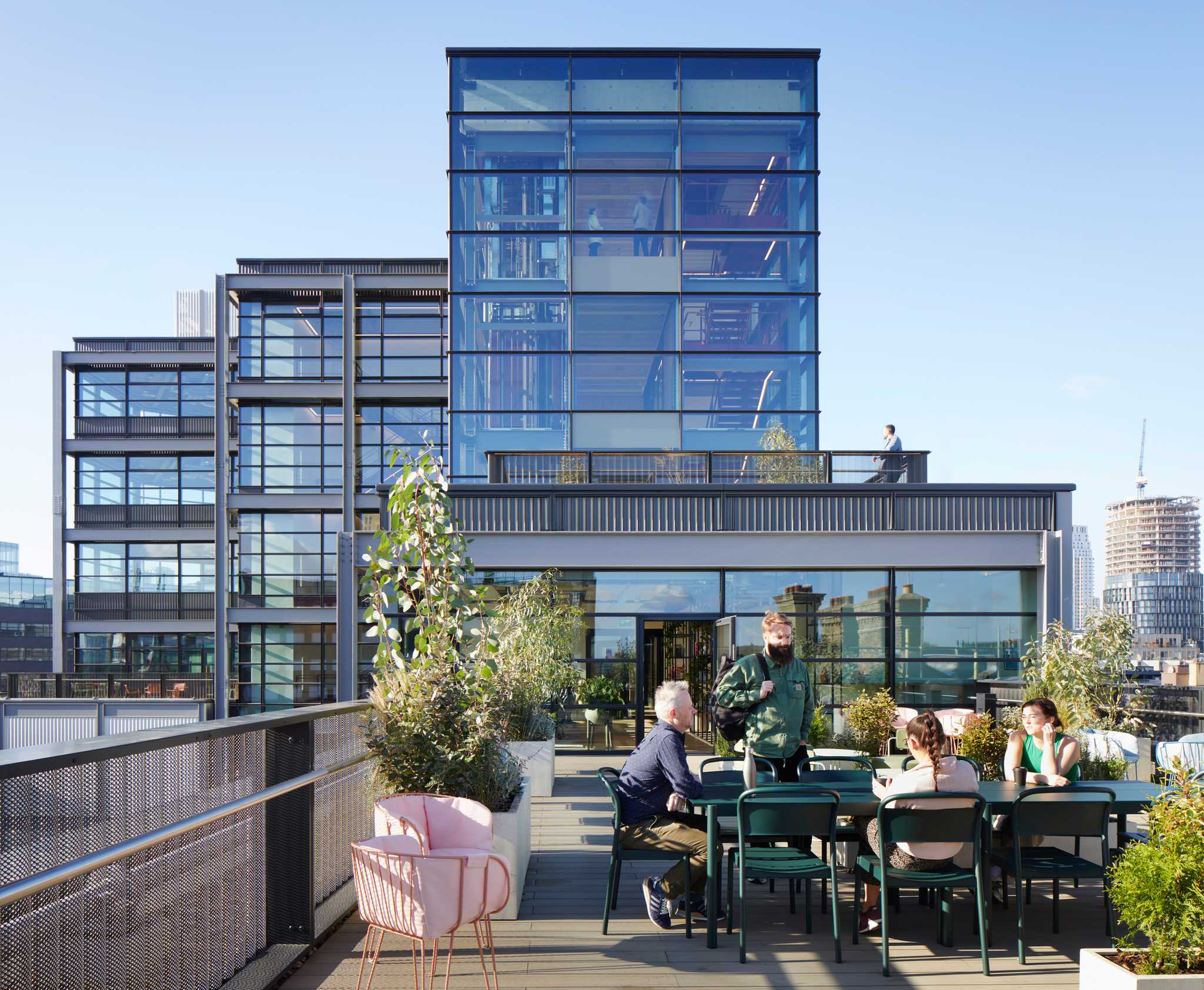 Fora Residents working on the roof terrace in the Shoreditch, Montacute Yards workspace.