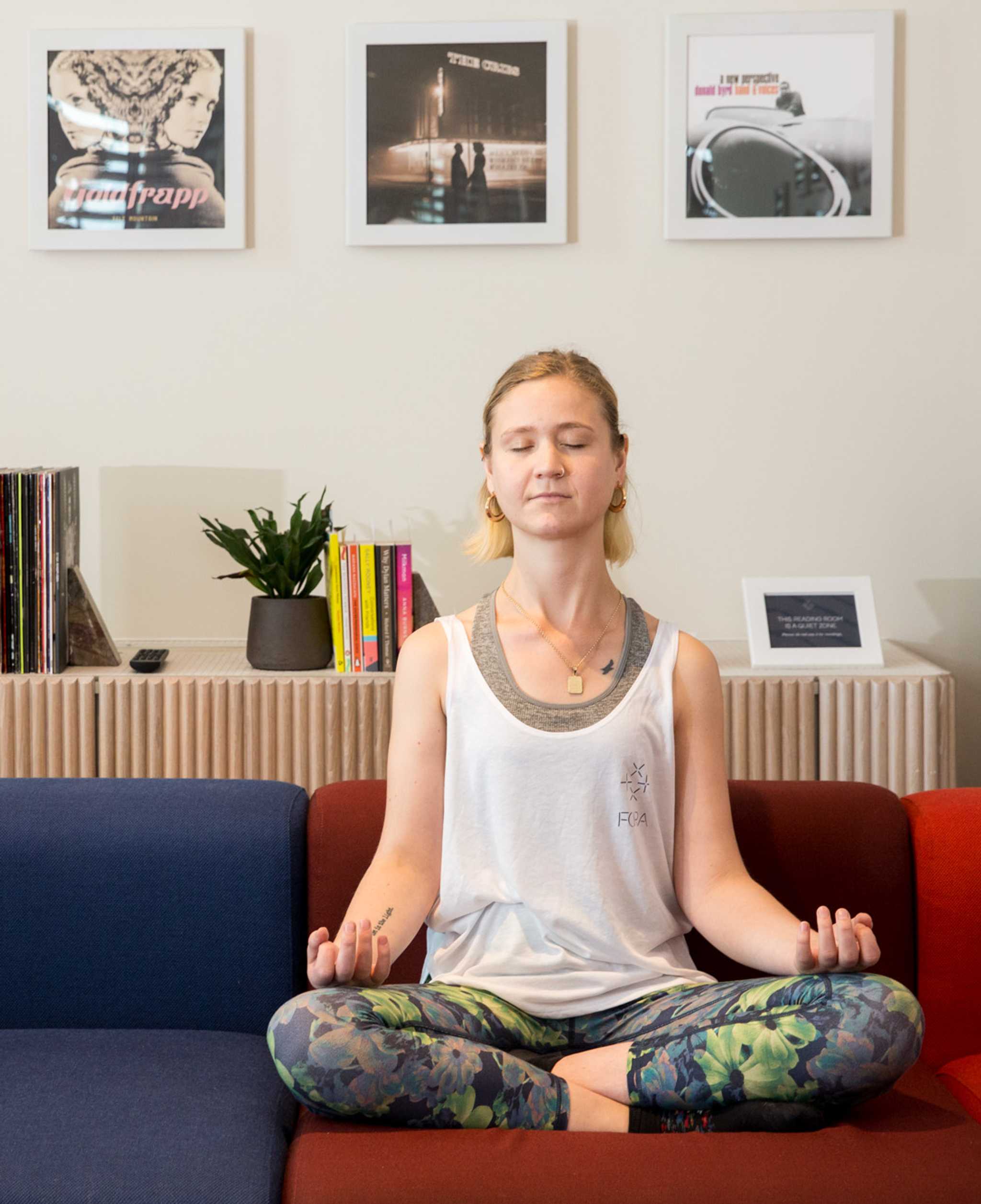 A resident practising yoga as part of the wellbeing services available in Fora’s serviced offices.