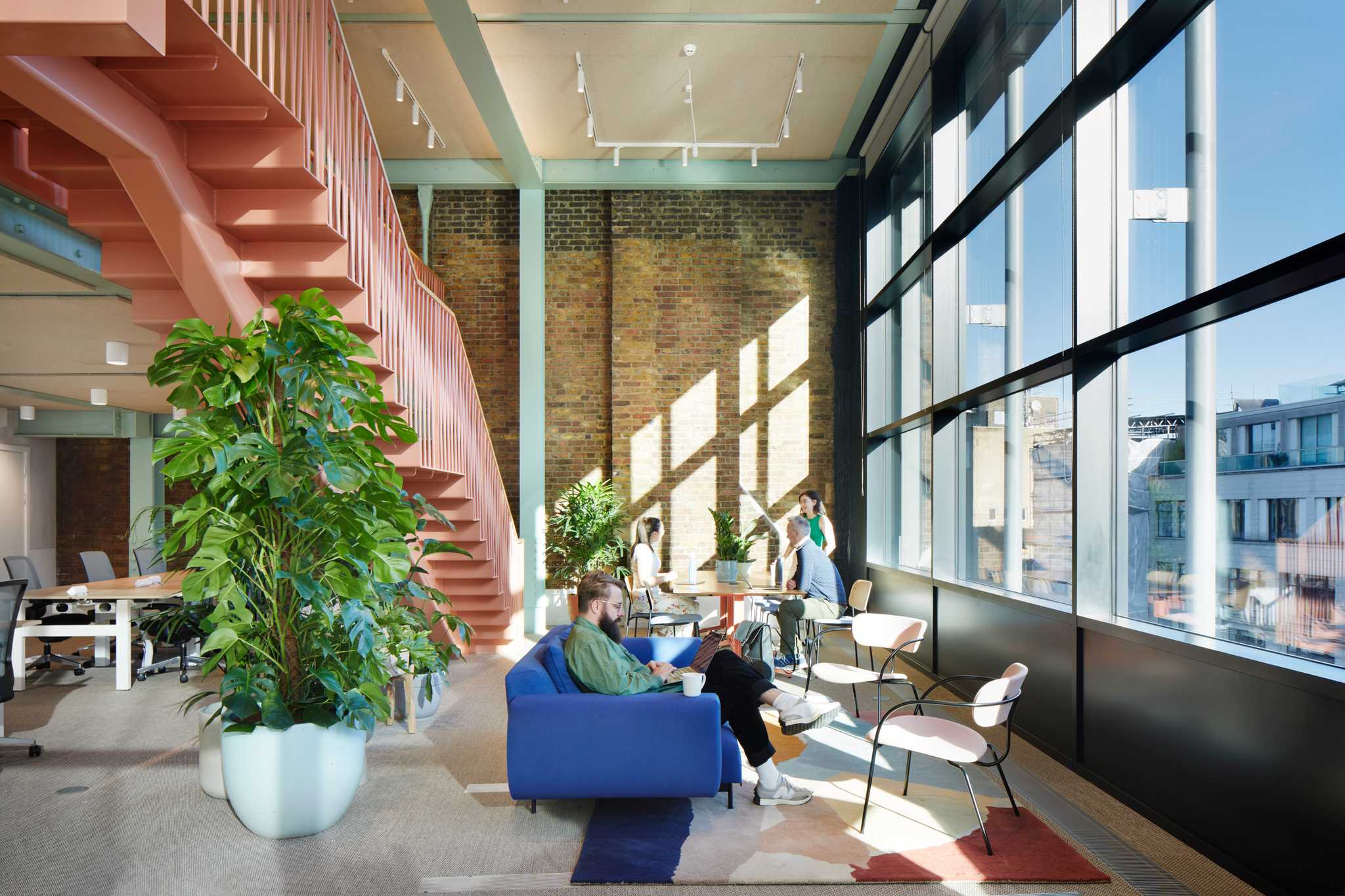 Fora Residents enjoying the flexible workspaces in the Shoreditch, Montacute Yards offices.