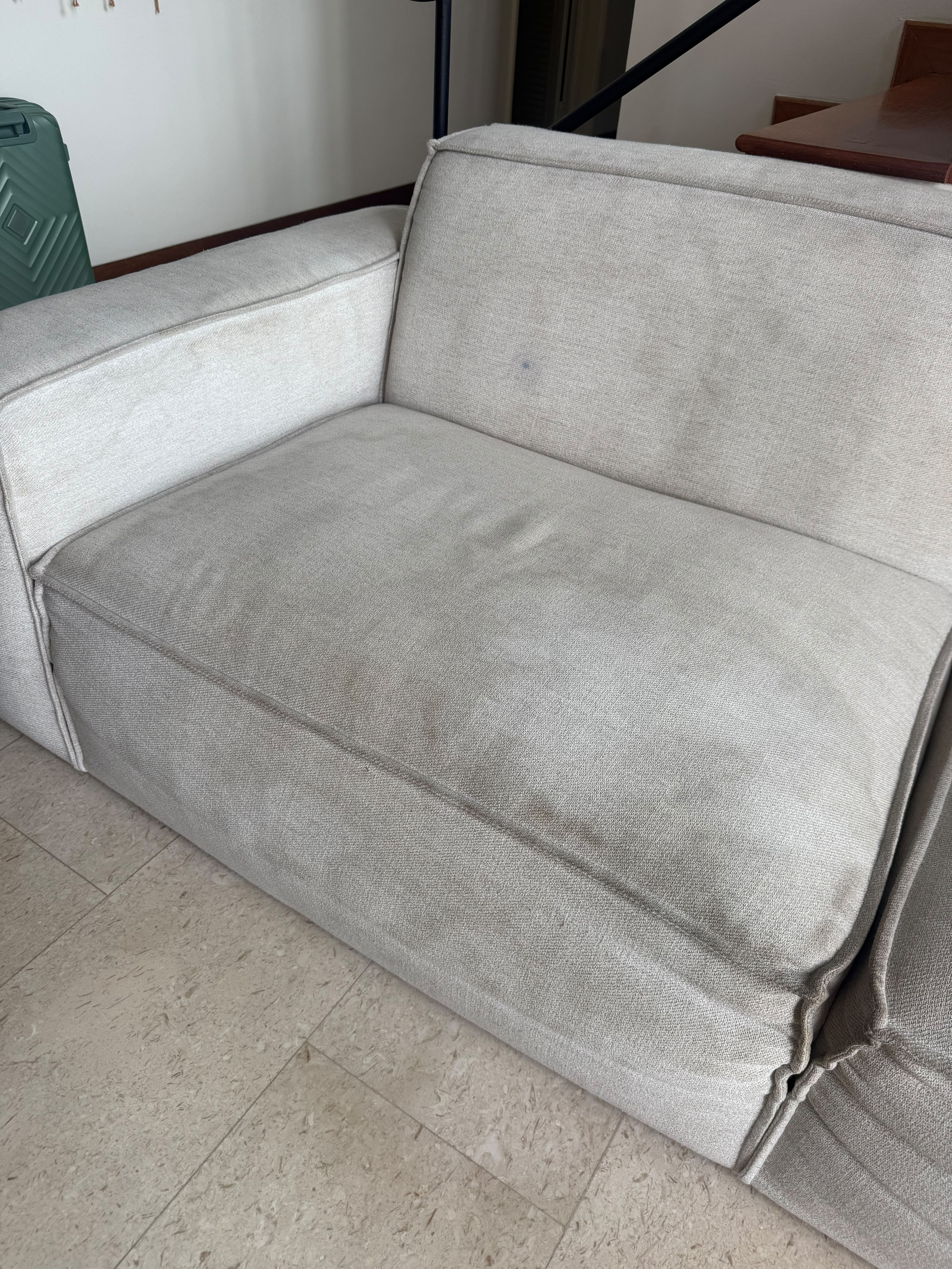L-shaped sofa before service close-up