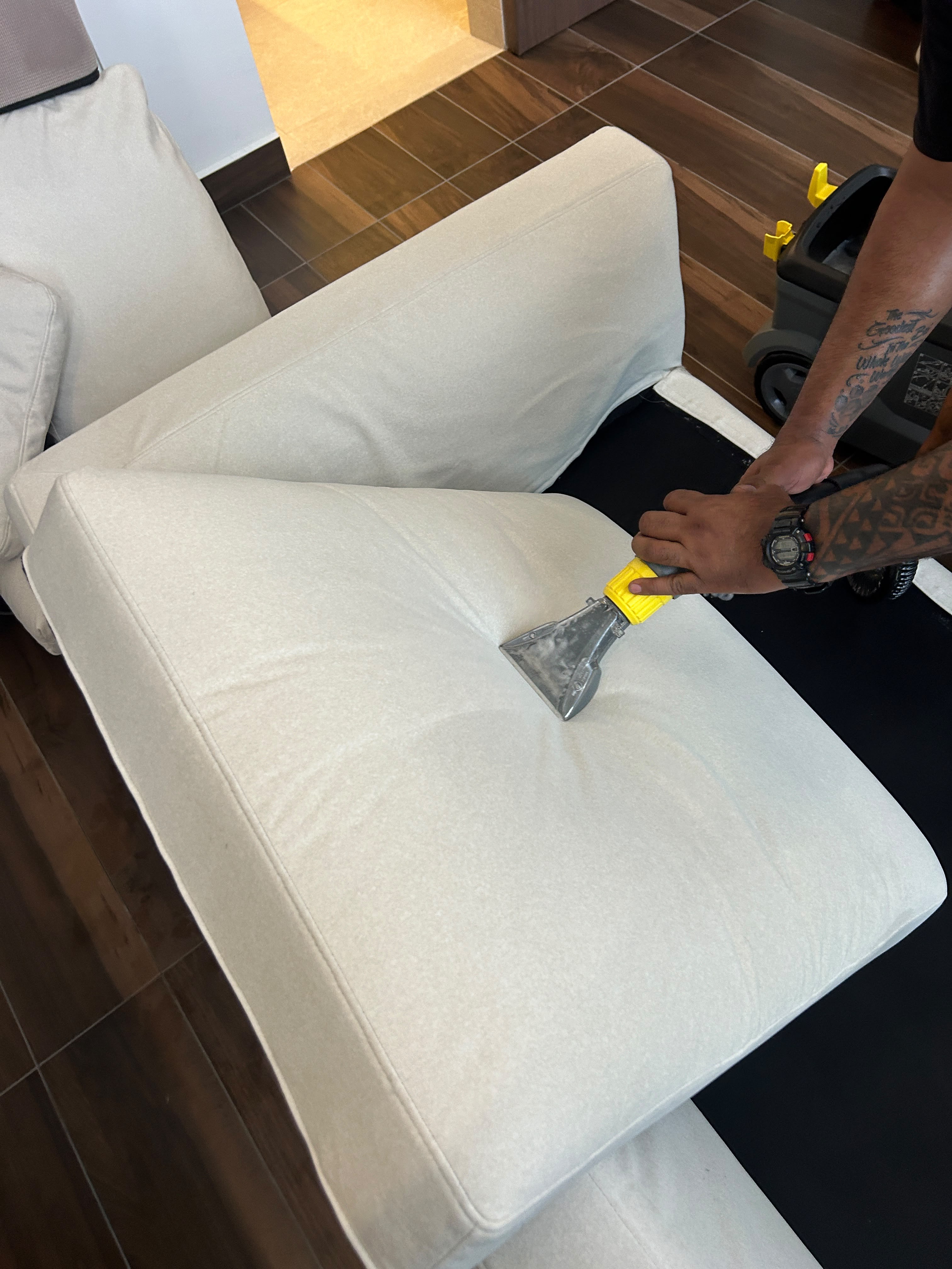 sofa being deep cleaned
