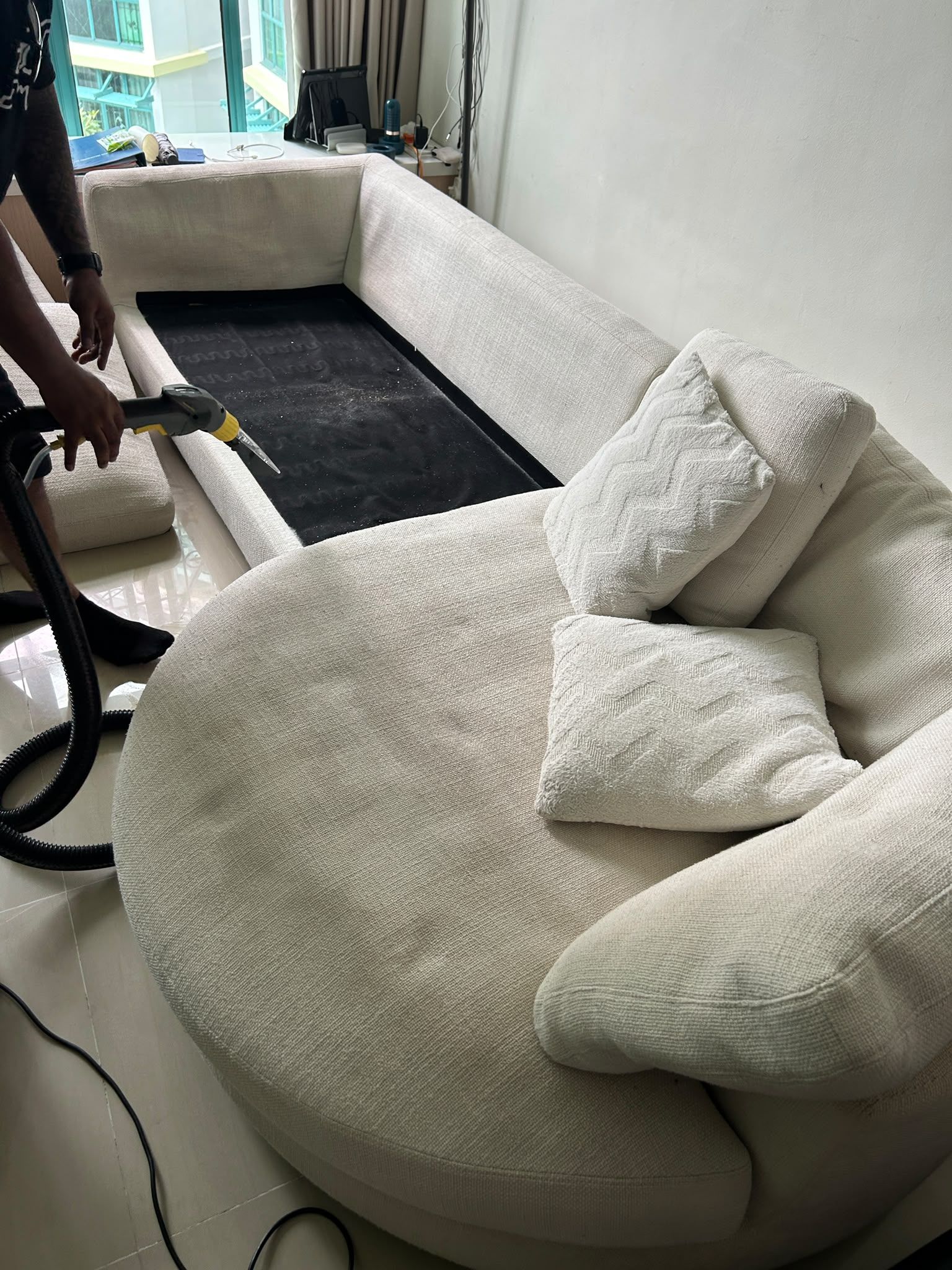 sofa being deep cleaned