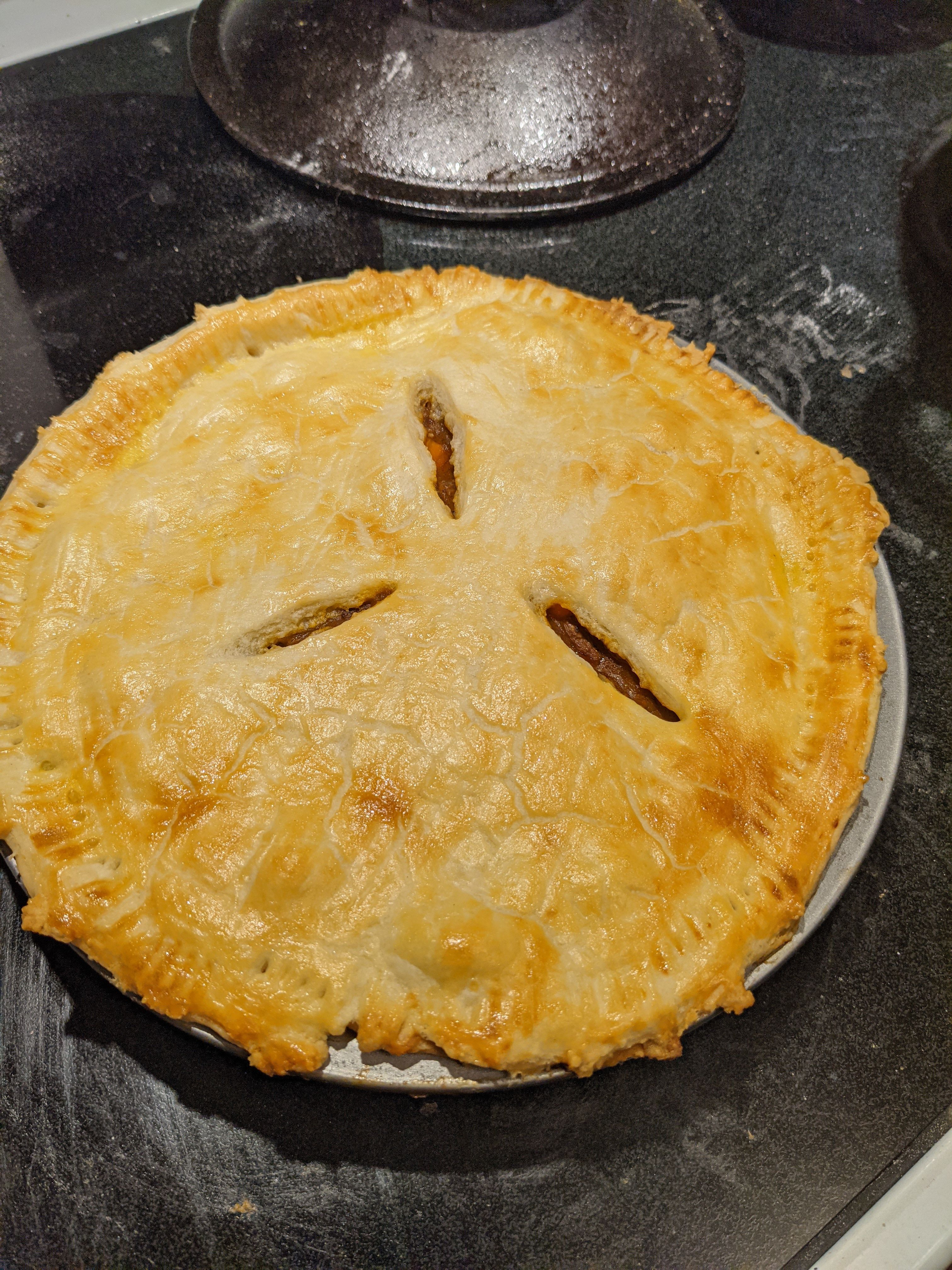 A finished steak and ale pie before being cut.