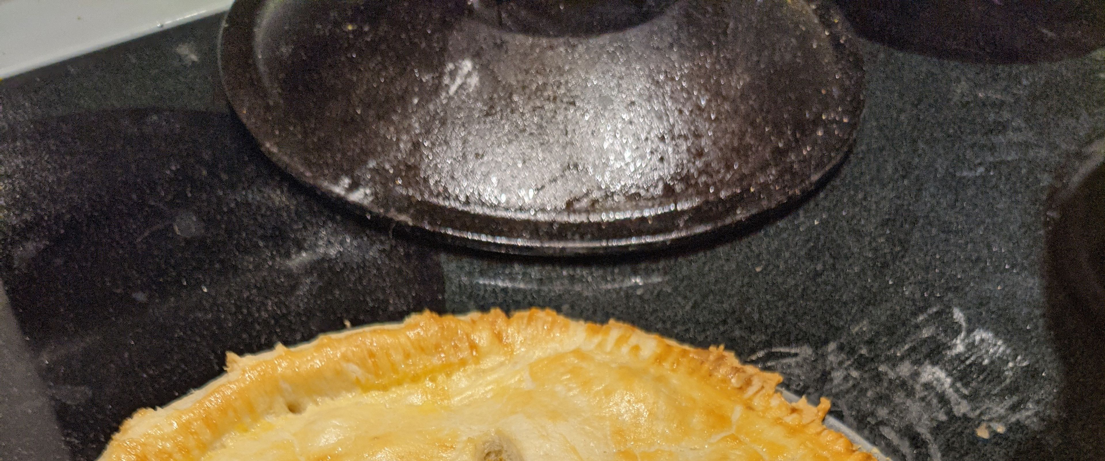 A finished steak and ale pie before being cut.