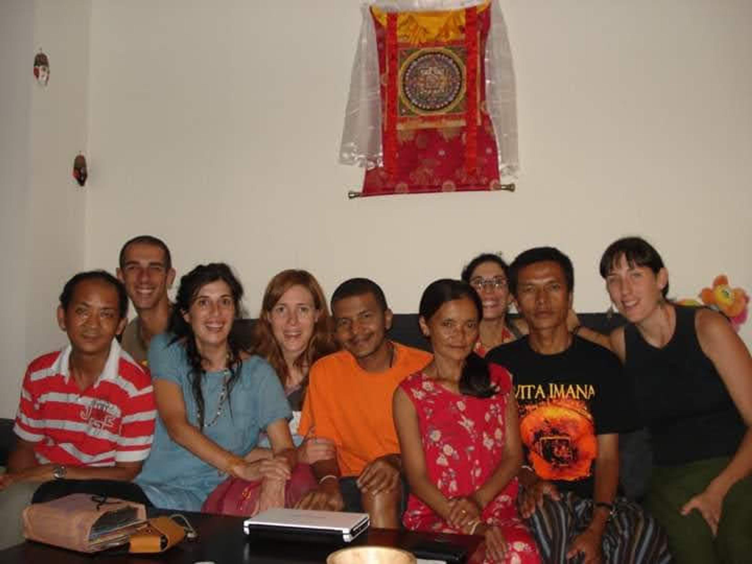 Saroj Khadgi seated with family members in a living room