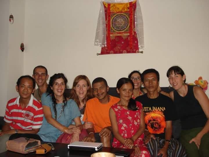 Saroj Khadgi seated with family members in a living room