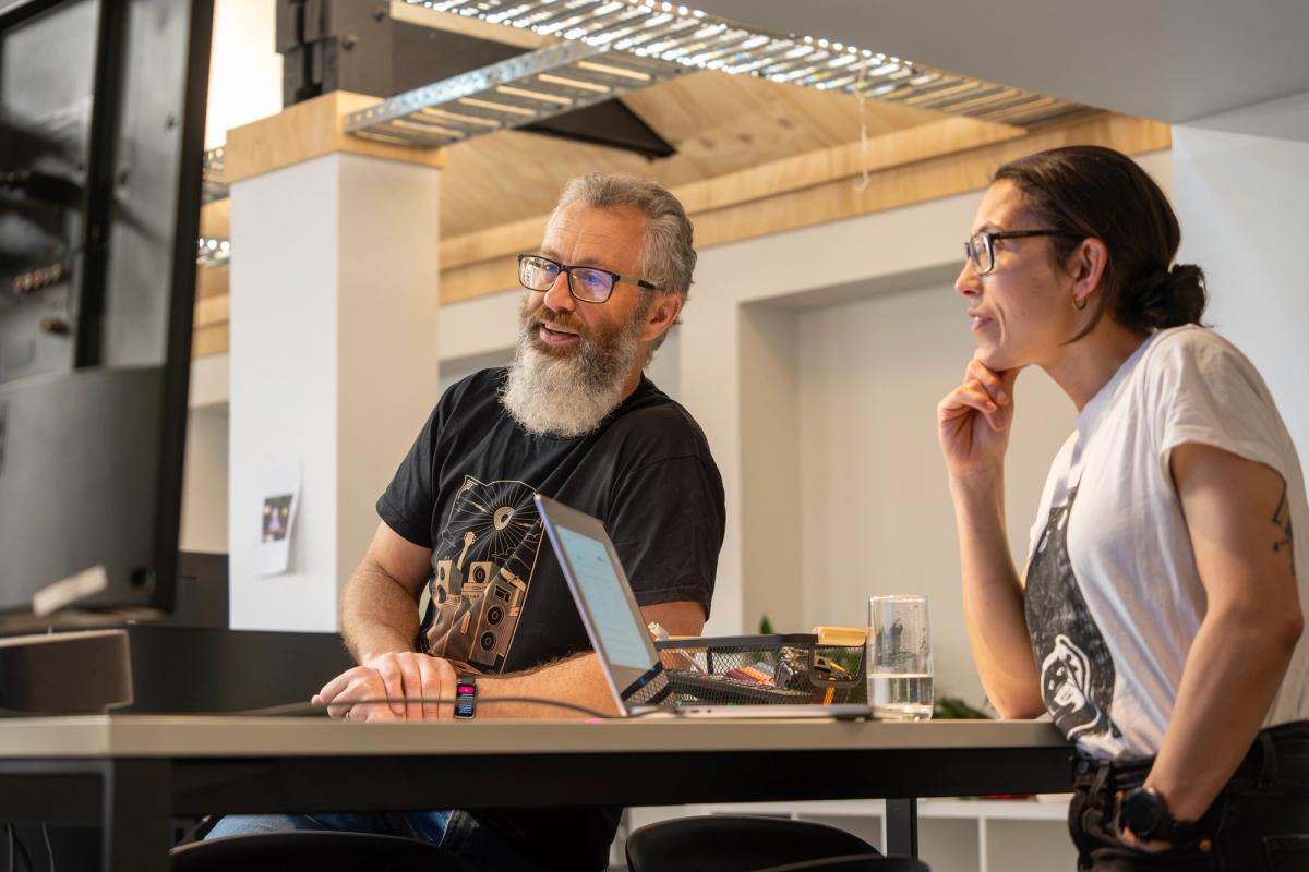 Max and Mandy discussing some code on a computer screen