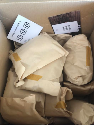 Brown paper backs in a cardboard box
