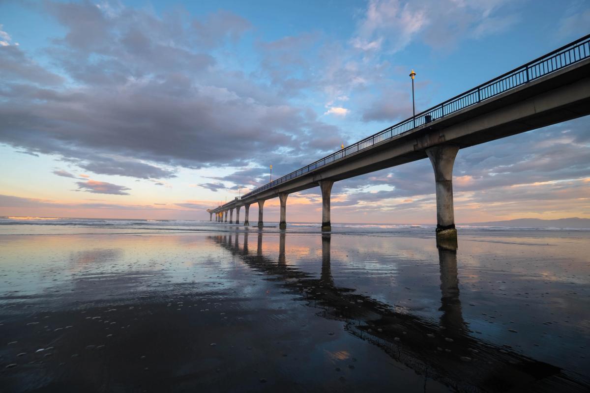 New Brighton pier at sunset, tide is out