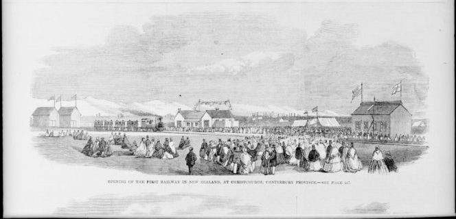 Black and white photo, buildings, railway and crowd in field