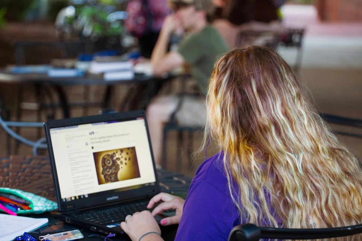 woman using computer to research
