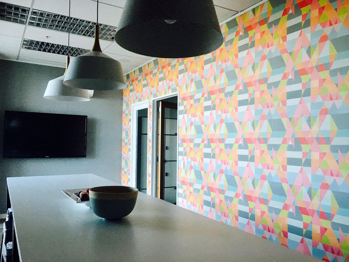 Long table, bright wallpaper, screen on wall