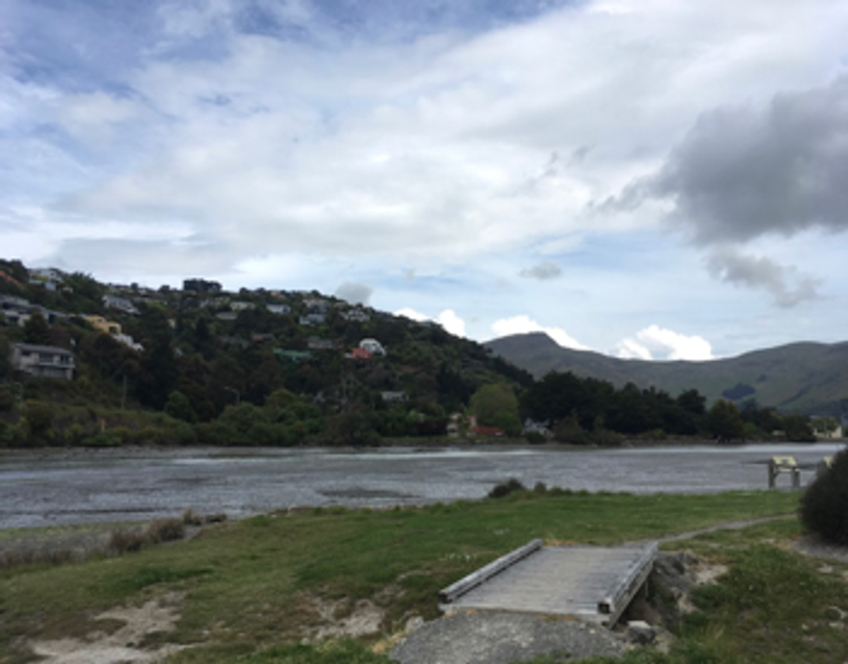 Heathcote river, house and hills in background, bridge in front
