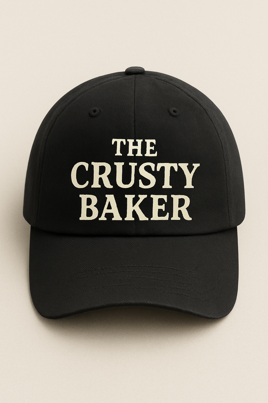 A sleek black cap featuring “The Crusty Baker” stitched across the front, blending casual comfort with a clean look.