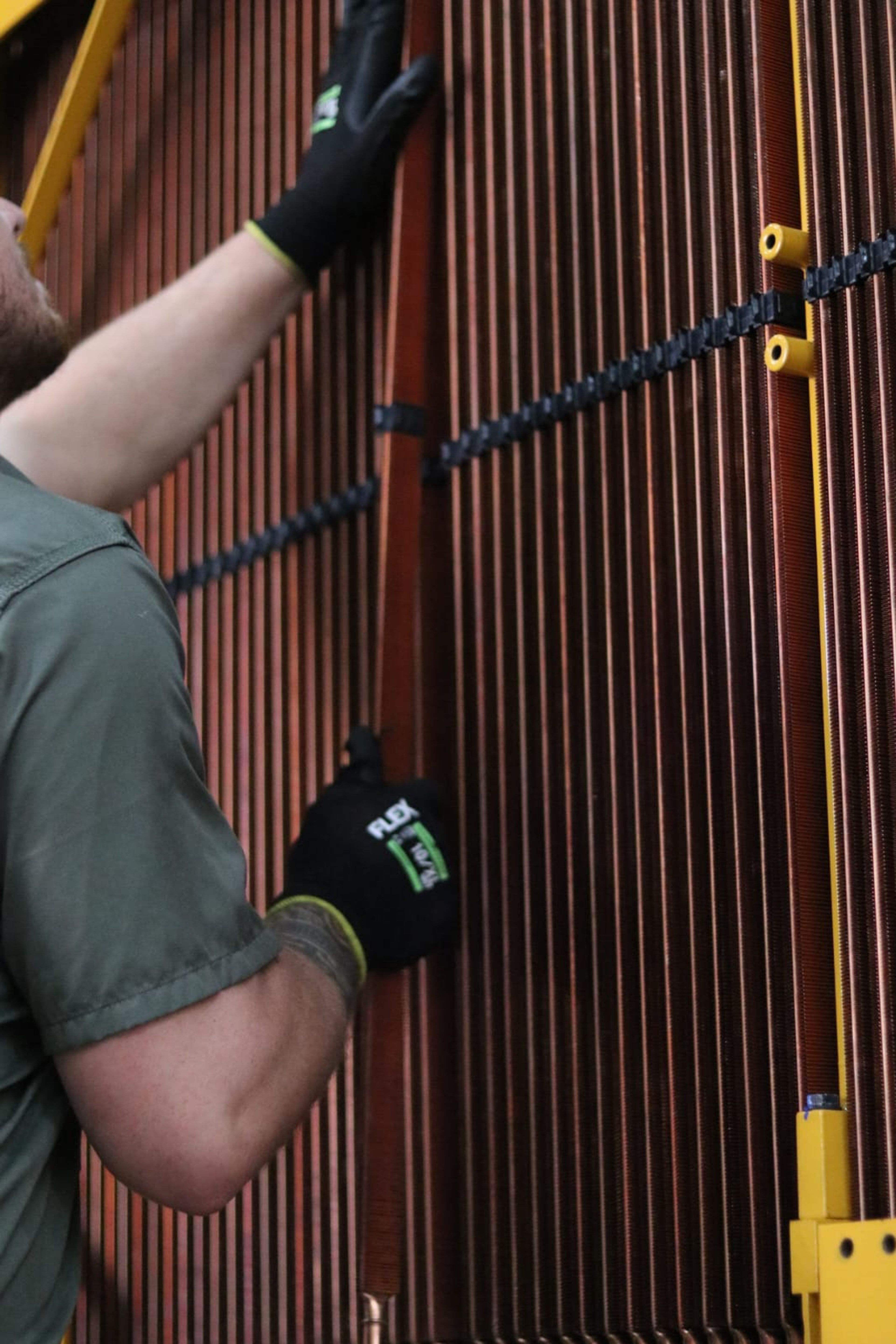 a man wearing a pair of black flex gloves